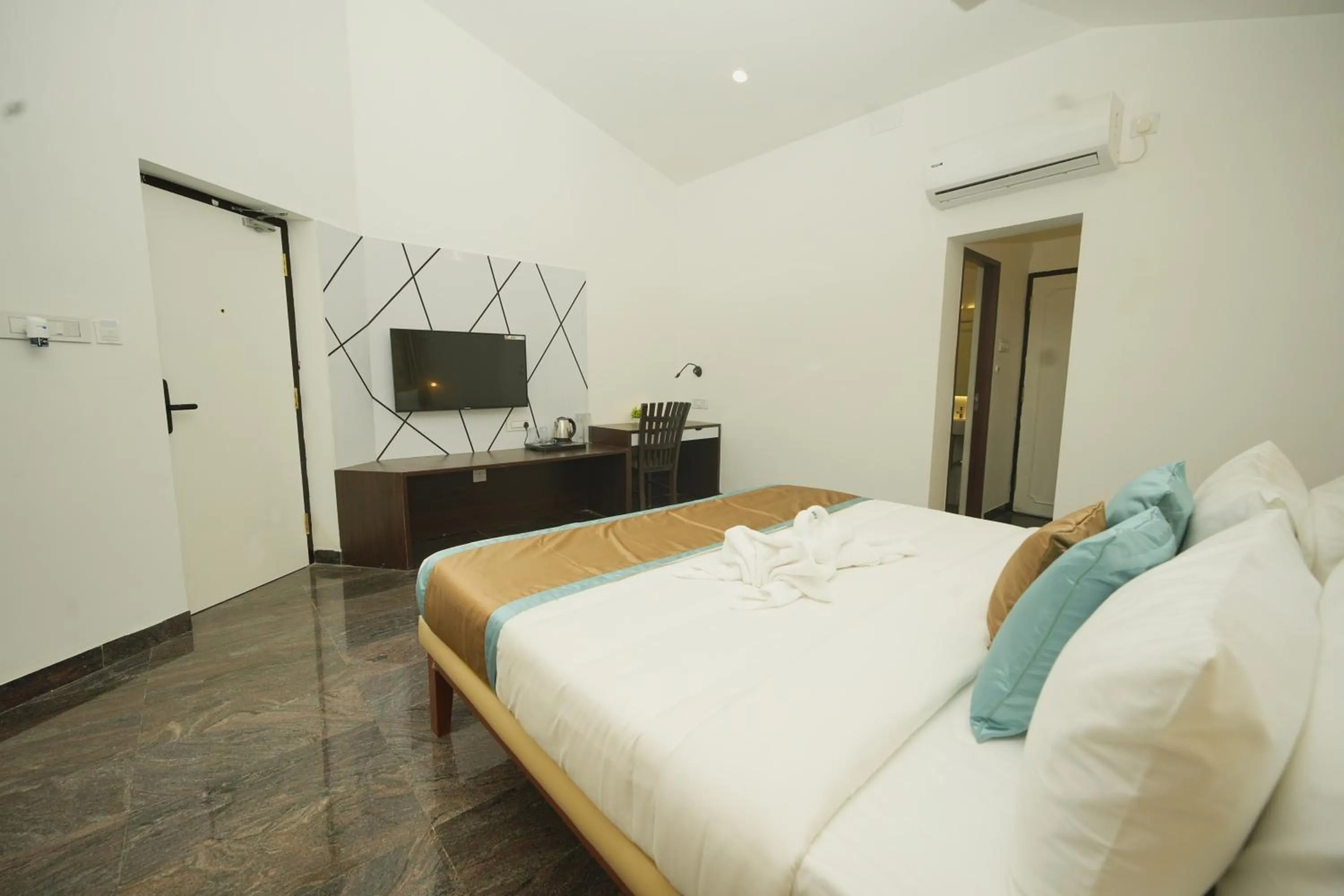 Bed in Bay Breeze Suites