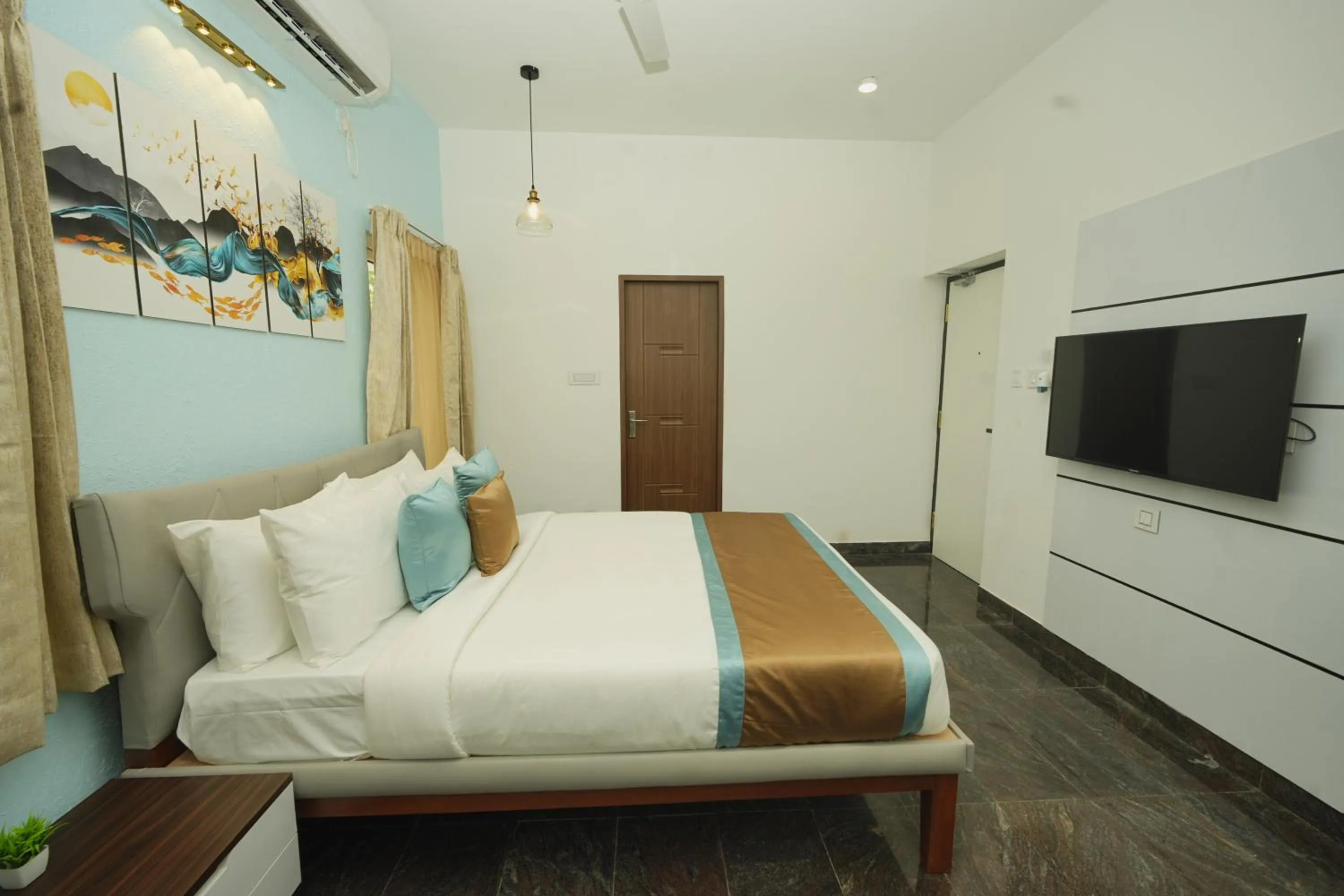 Bed in Bay Breeze Suites