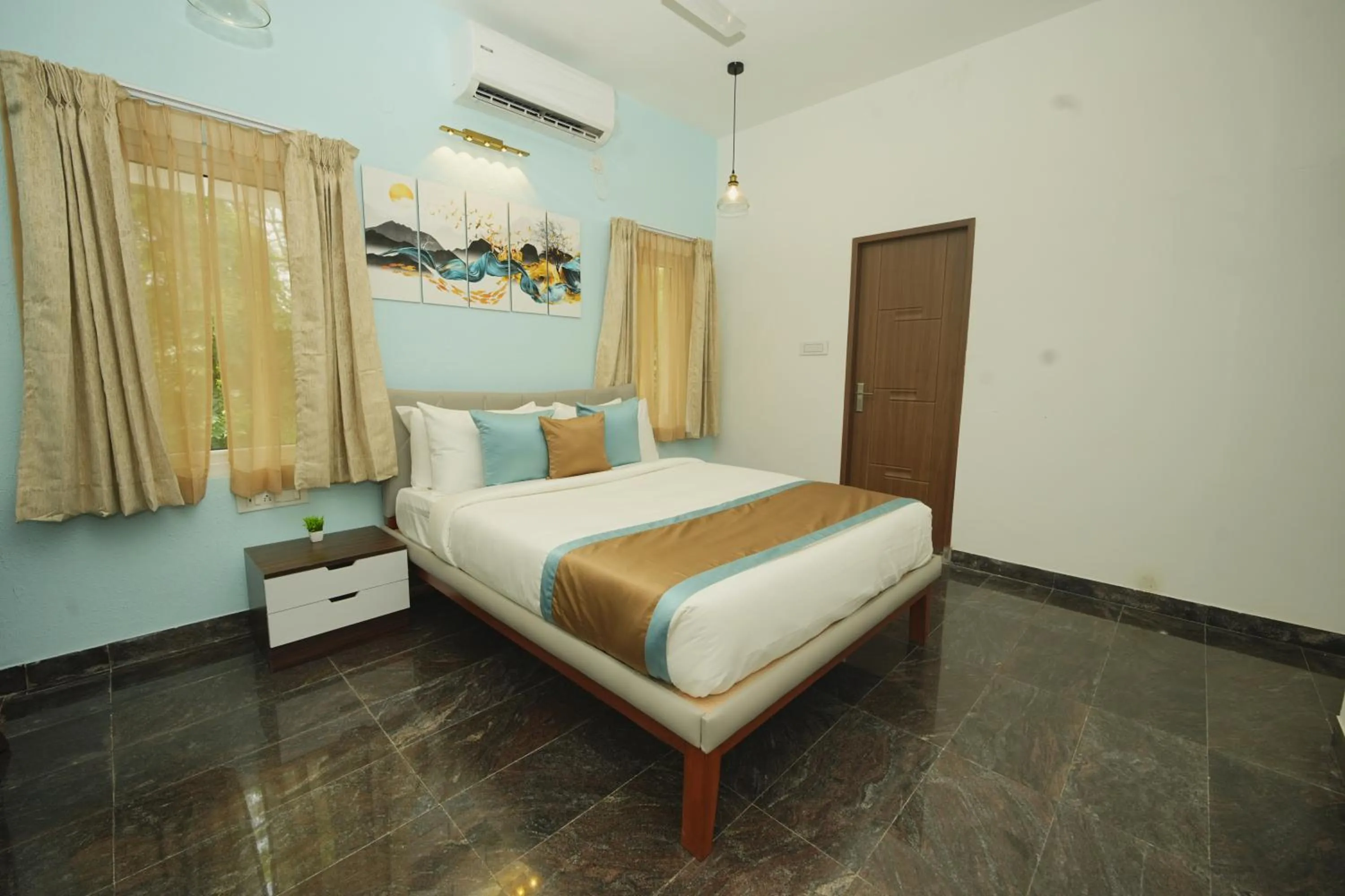 Bed in Bay Breeze Suites