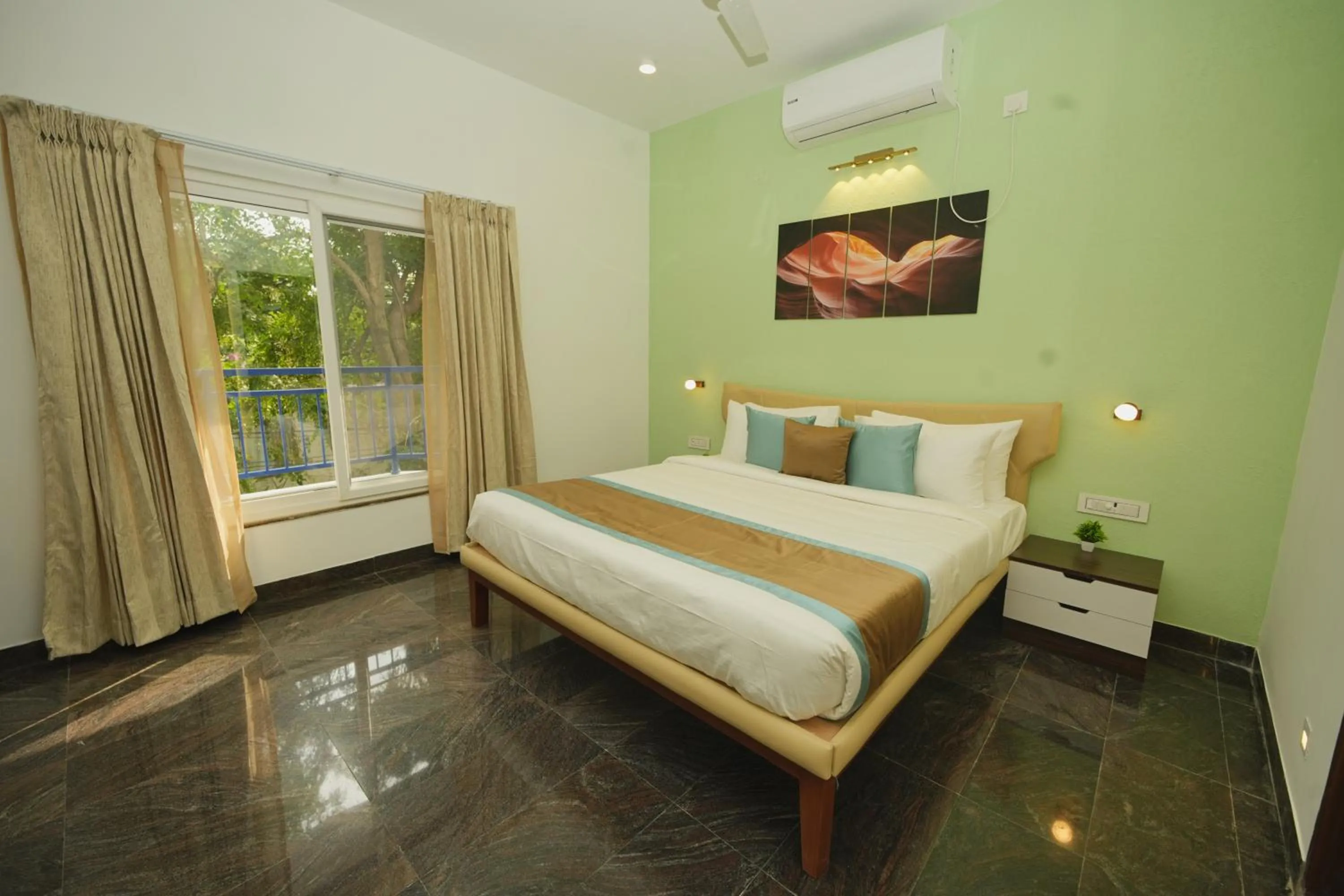 Bed in Bay Breeze Suites