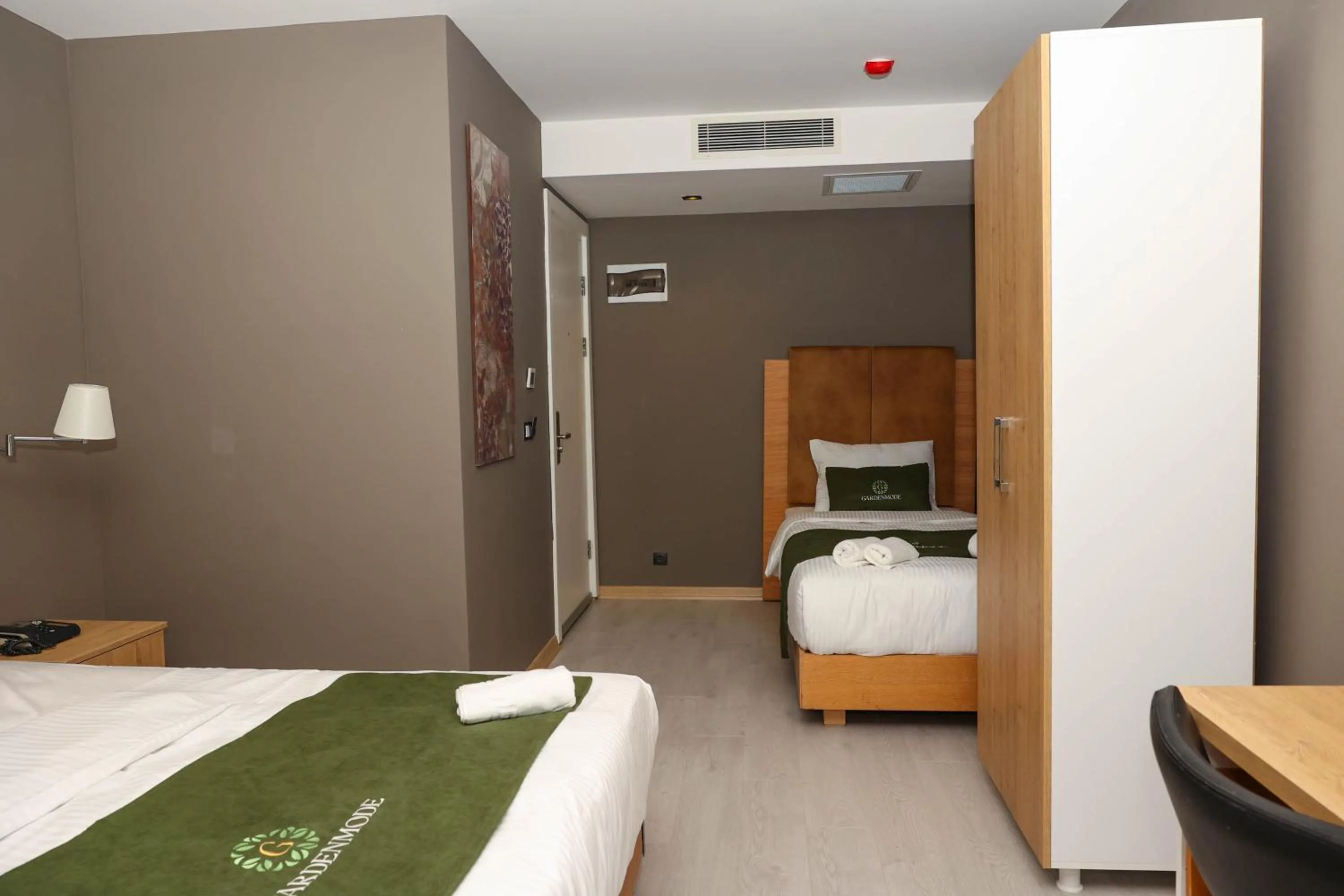 Bed in Gardenmode Airport Hotel