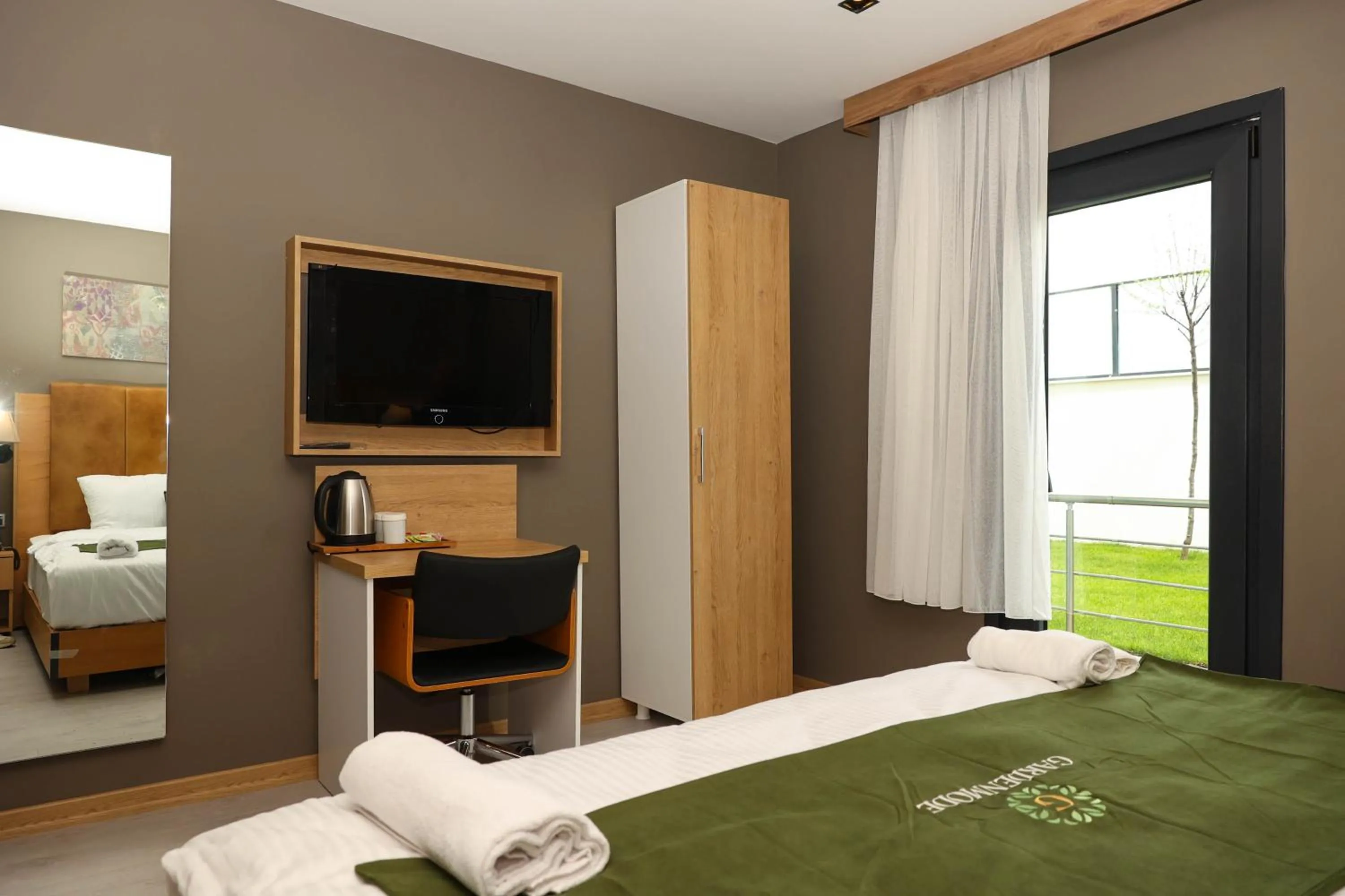 Bed in Gardenmode Airport Hotel