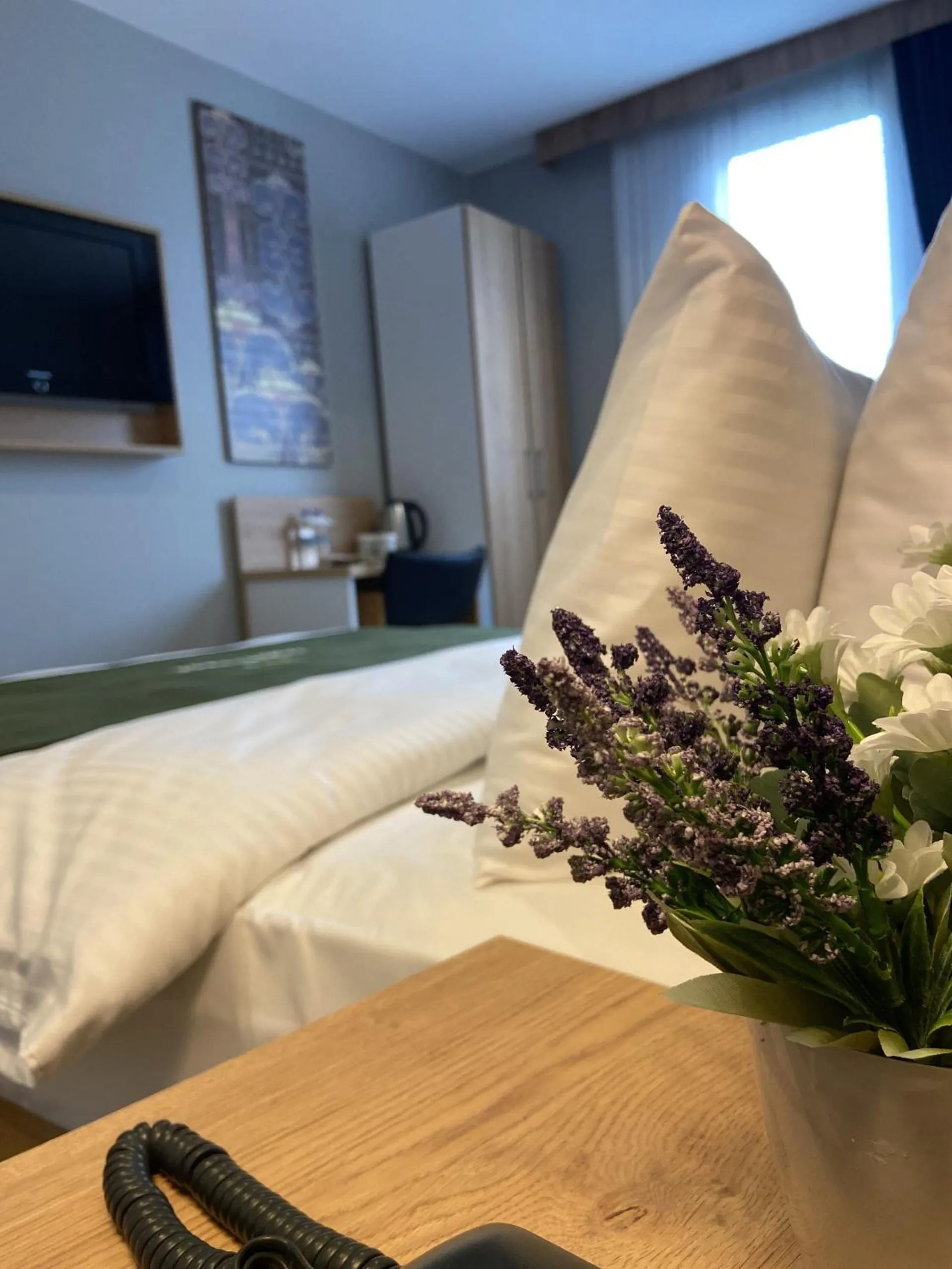 Bed in Gardenmode Airport Hotel