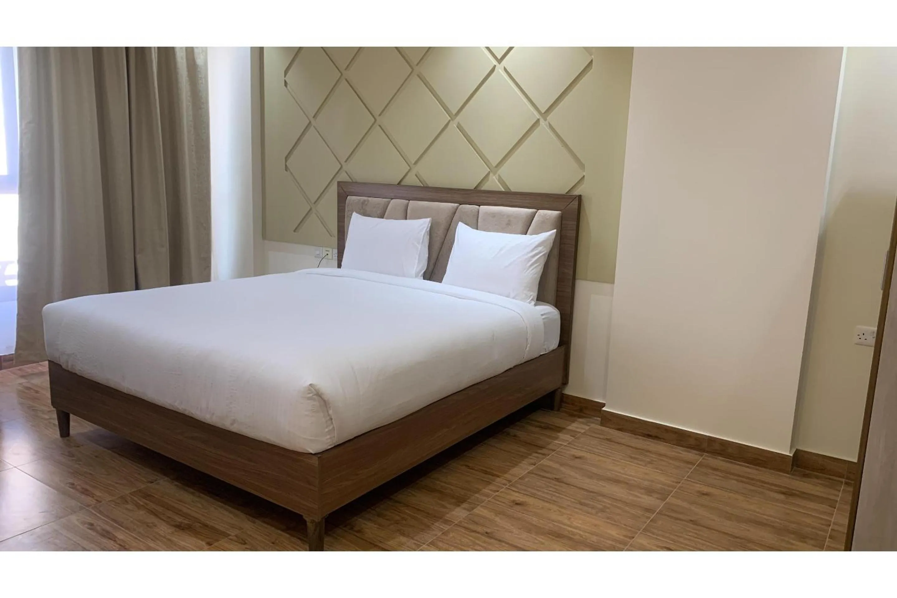 Bedroom, Bed in OYO Townhouse 156 Rose Hotel Apartments