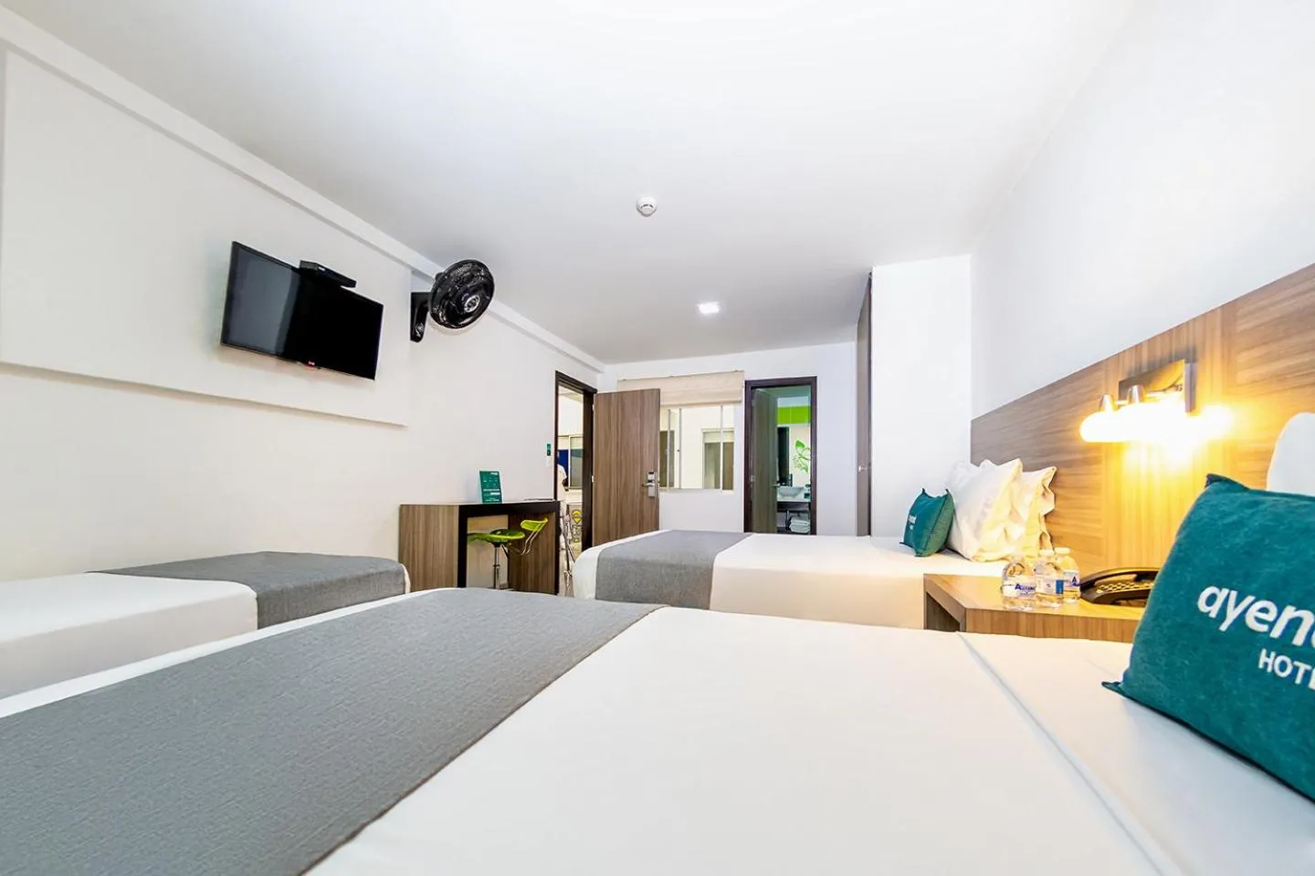 Communal lounge/ TV room, Bed in Hotel MH Pereira