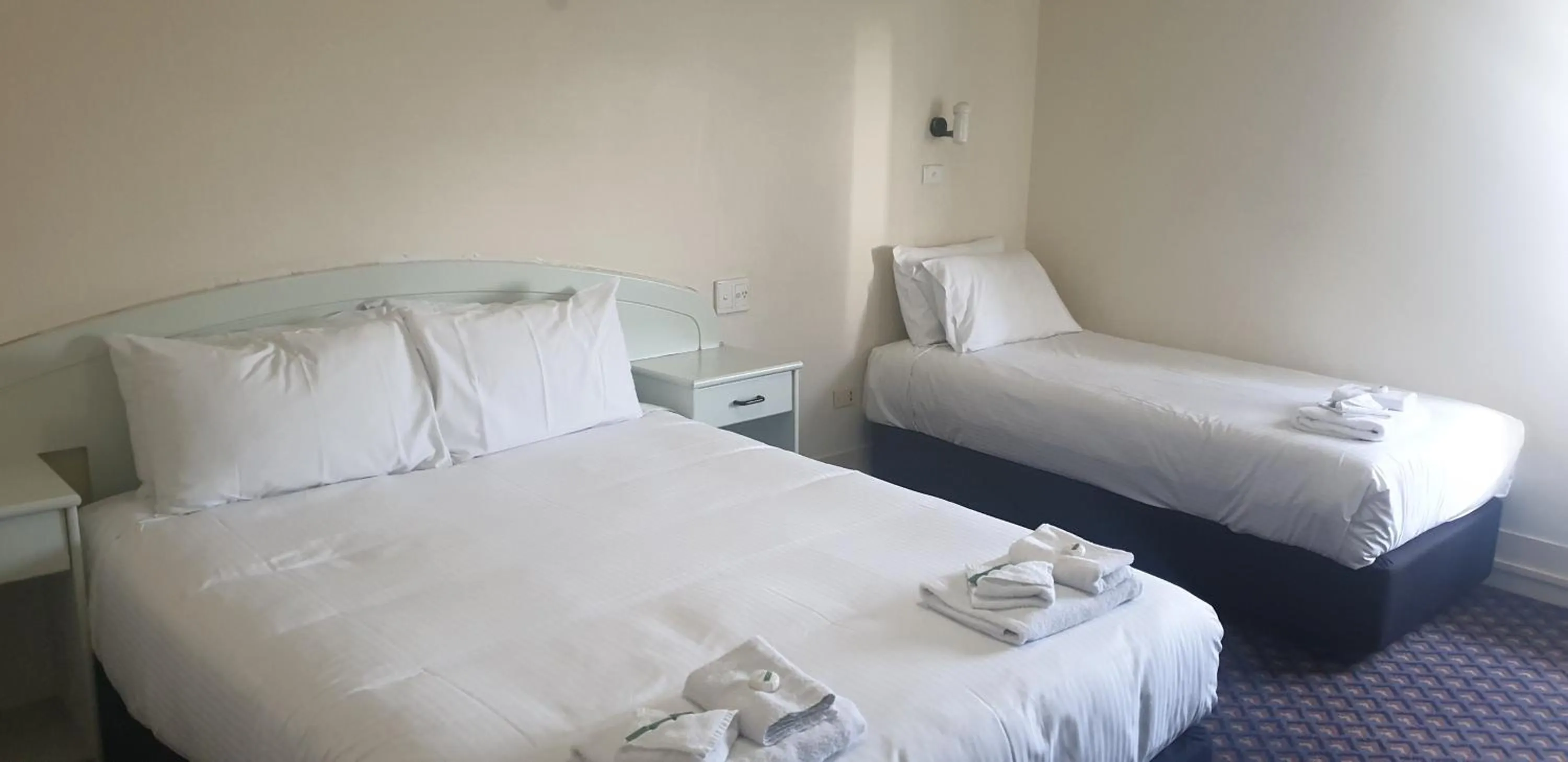 Bed in Grand Tasman Hotel