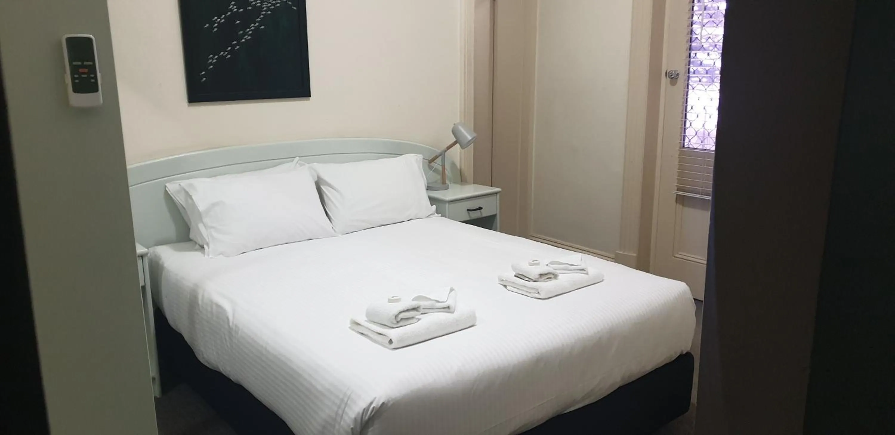 Bed in Grand Tasman Hotel