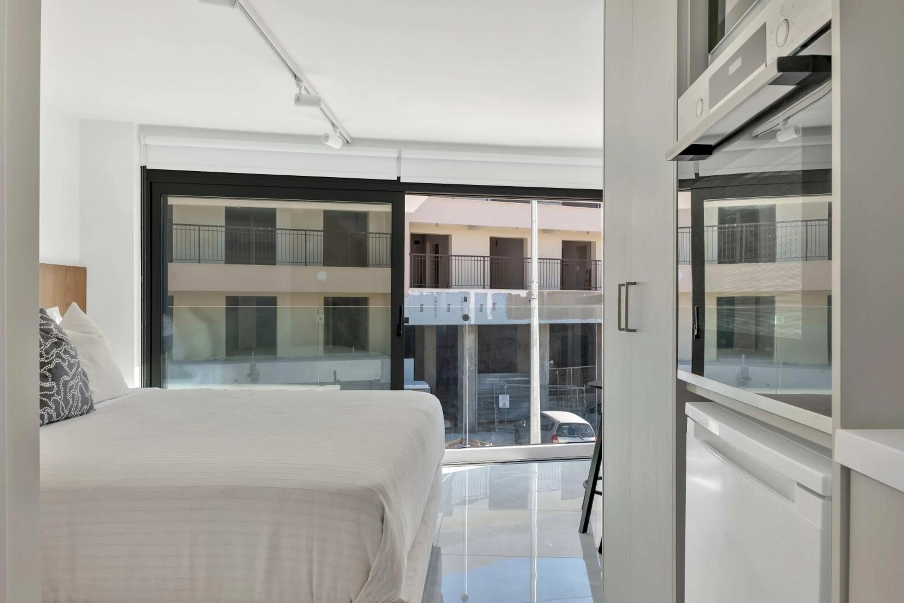 Bed in Phaedrus Living Alkminis Seaview Suites Pantai