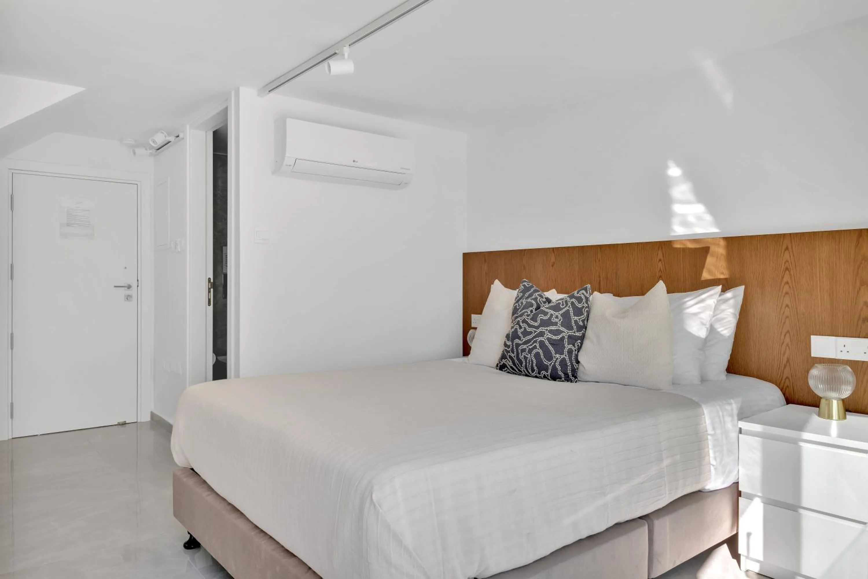 Bed in Phaedrus Living Alkminis Seaview Suites Pantai
