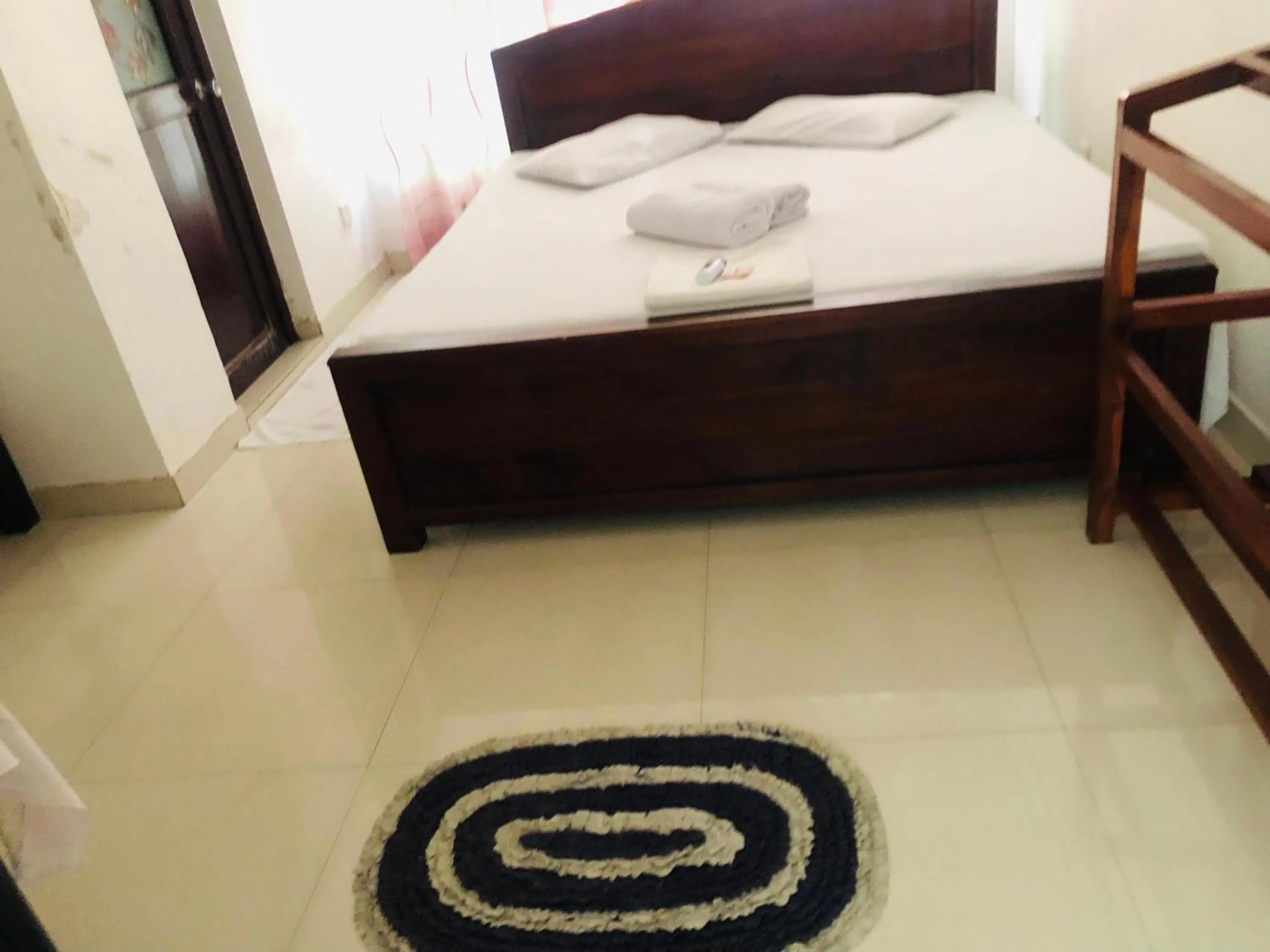 Bed in Senanayaka Holiday Inn