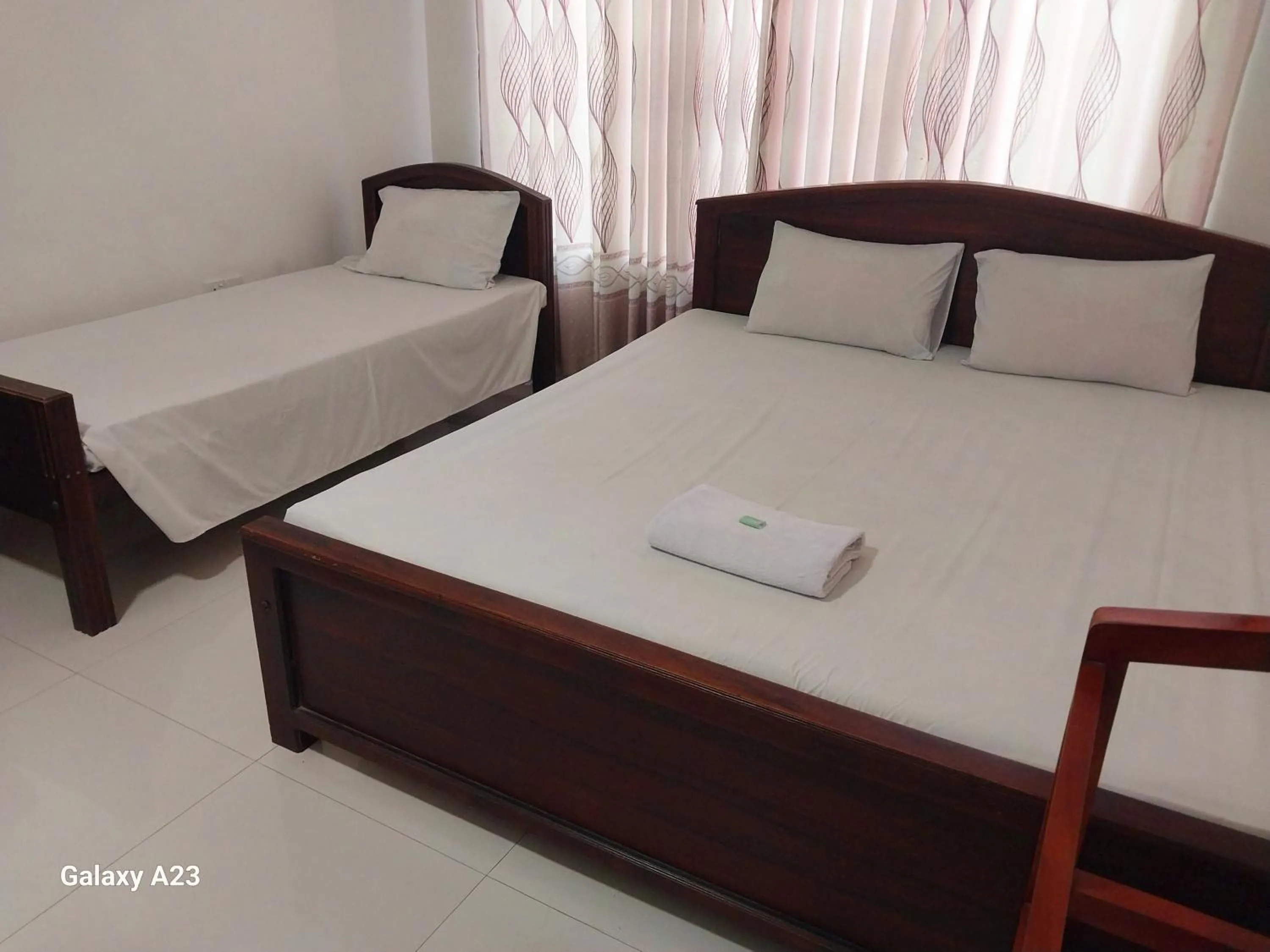 Bed in Senanayaka Holiday Inn