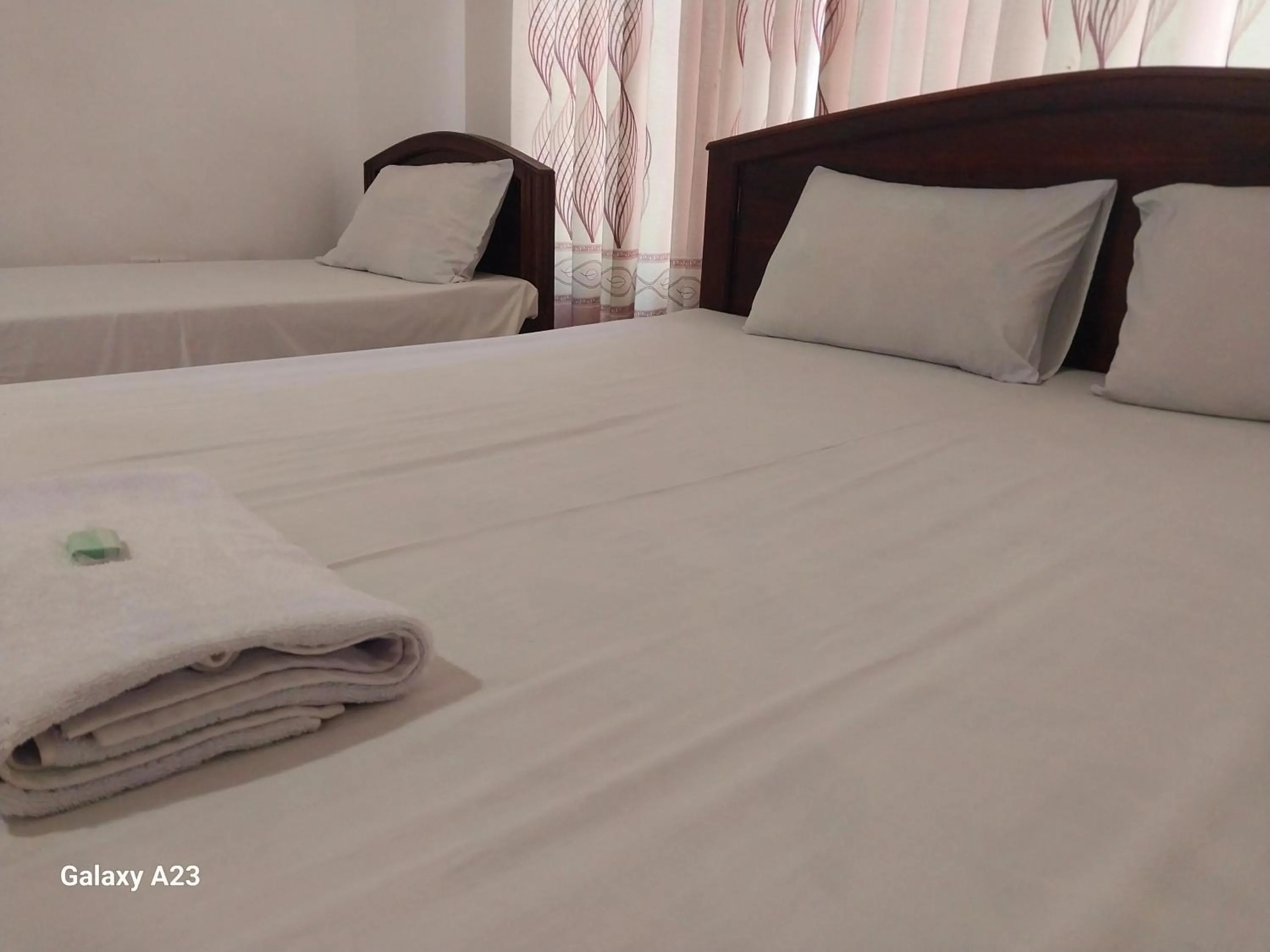 Bed in Senanayaka Holiday Inn