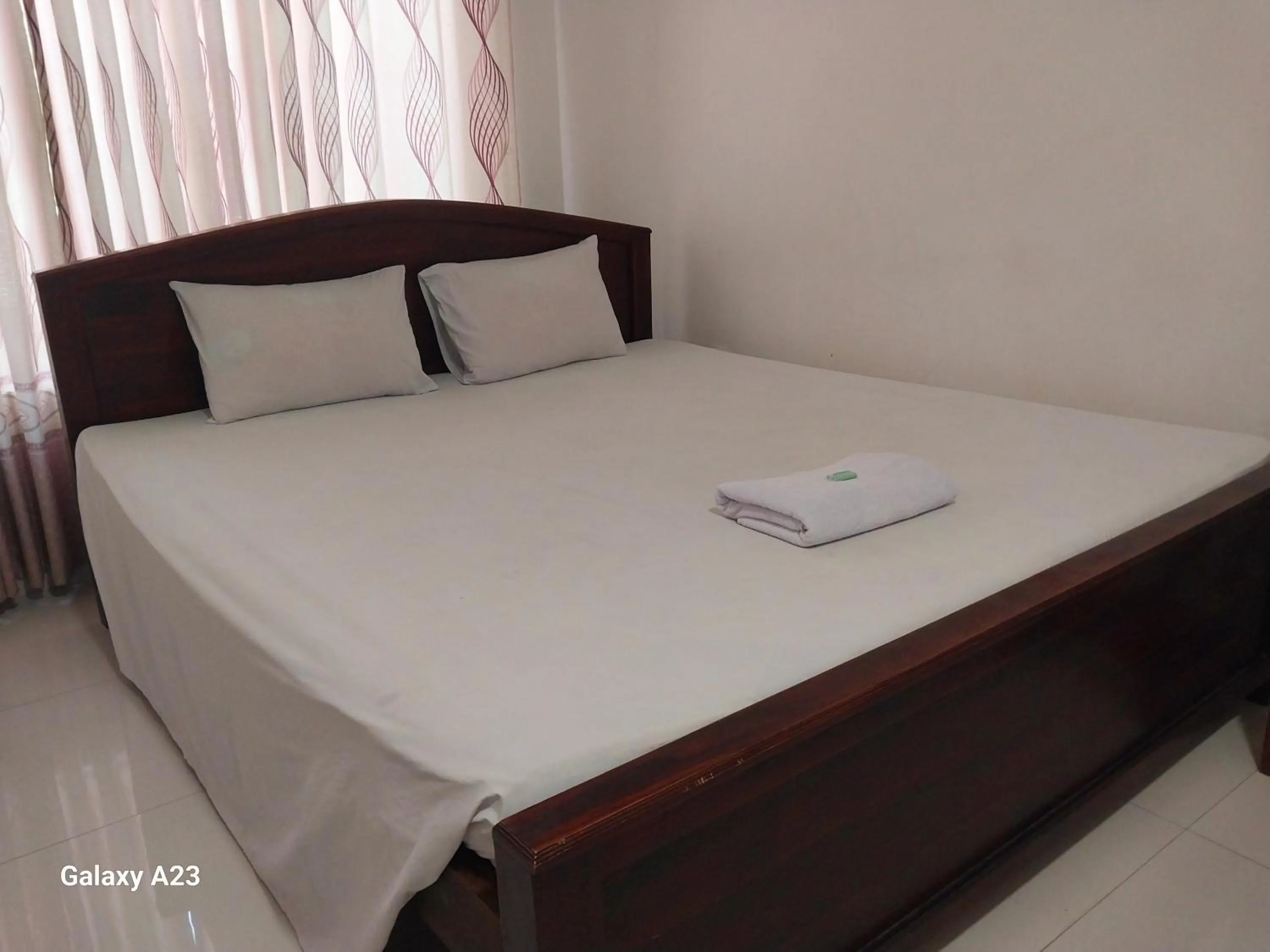 Bed in Senanayaka Holiday Inn
