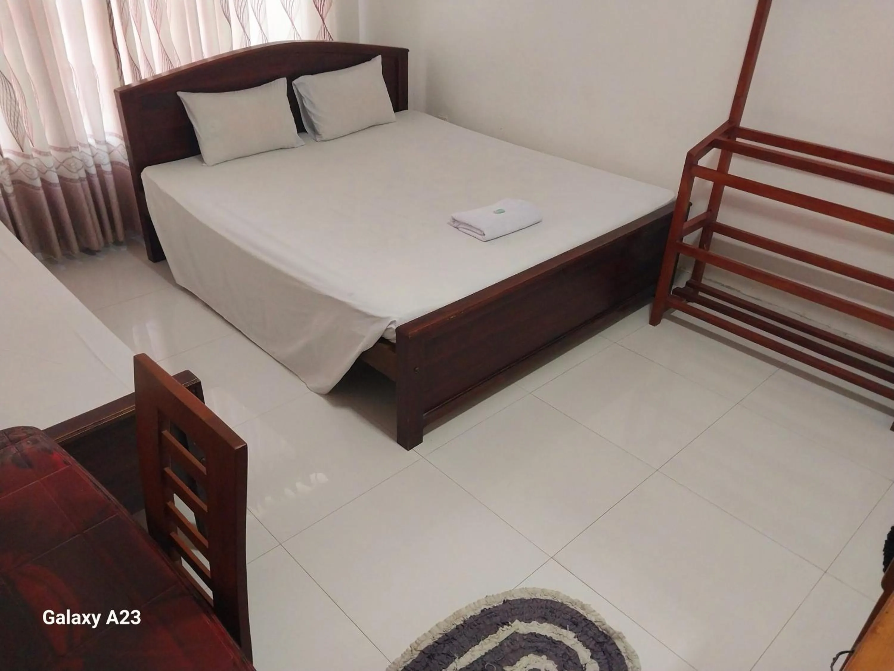 Bed in Senanayaka Holiday Inn