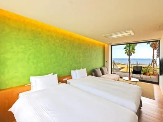 Bed in そらすな Beach Side Resort Hotel