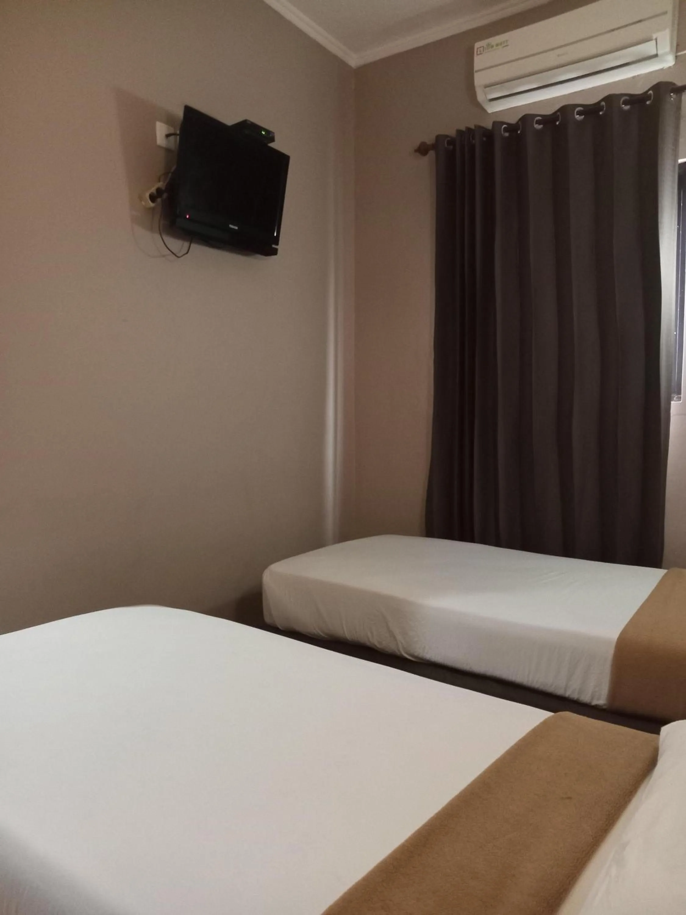 Bed in Violand Garden Hotel Samarinda