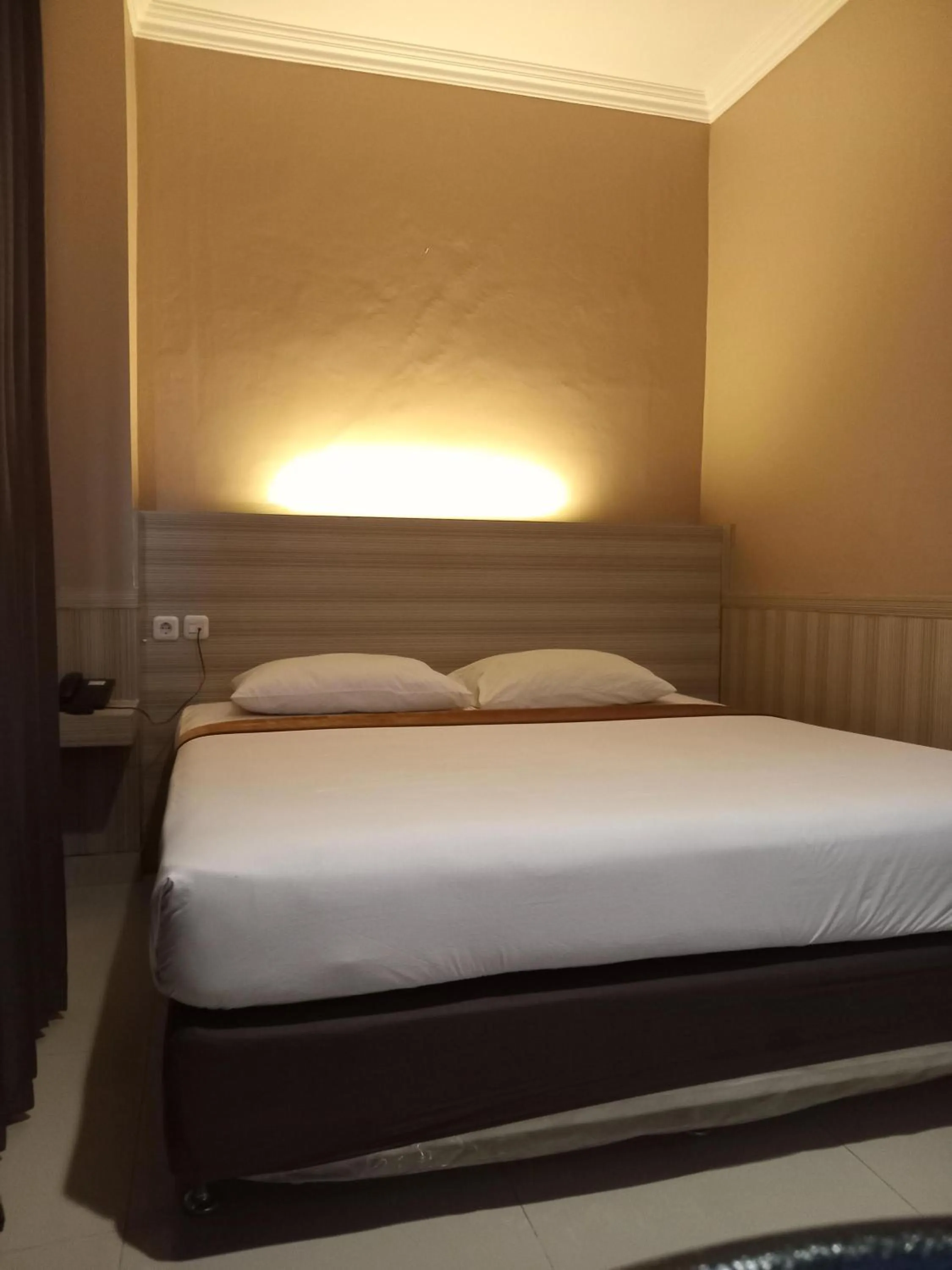 Bed in Violand Garden Hotel Samarinda