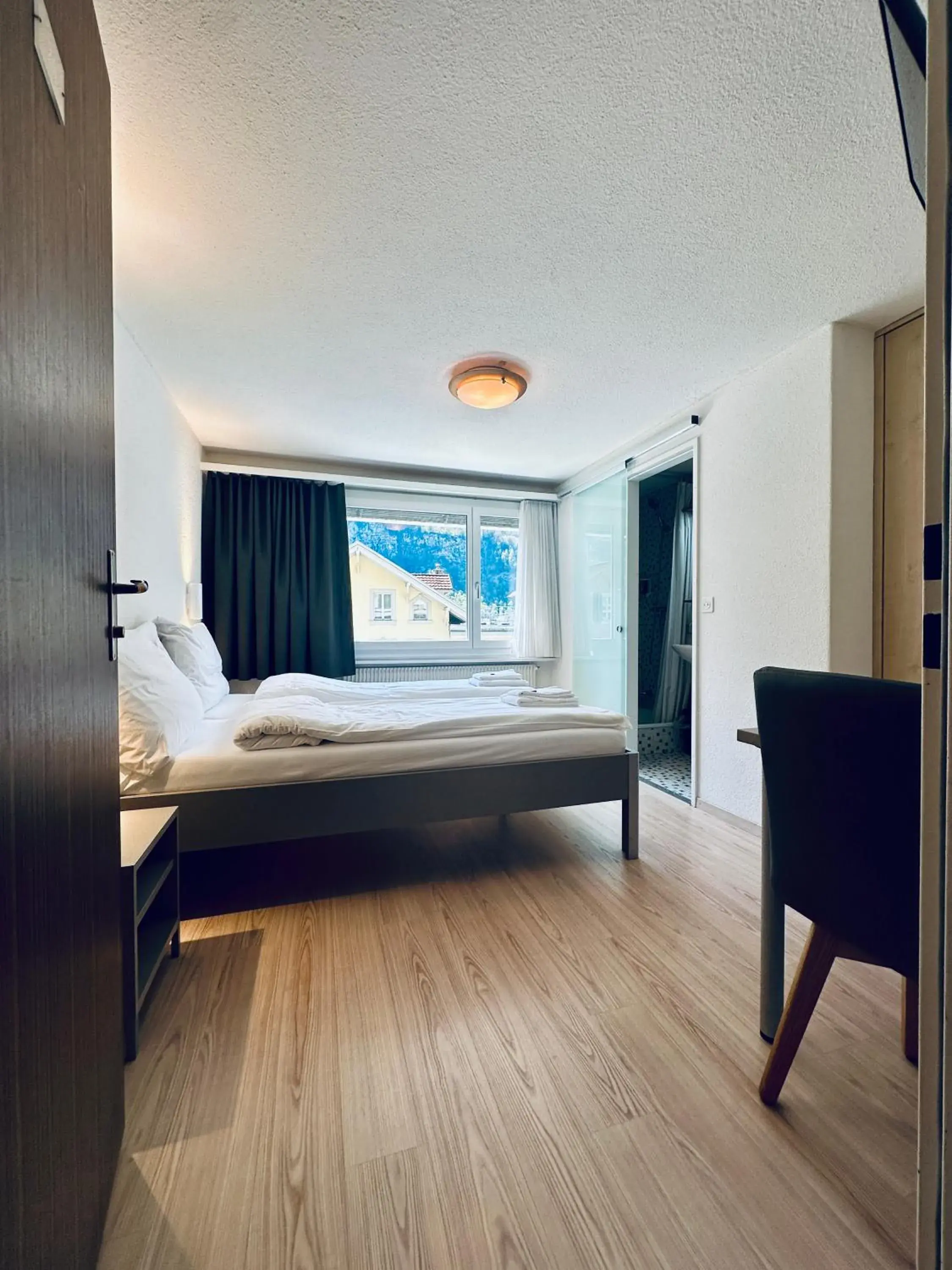 Bed in Hotel Rebstock Meiringen Bed in Hotel Rebstock Meiringen