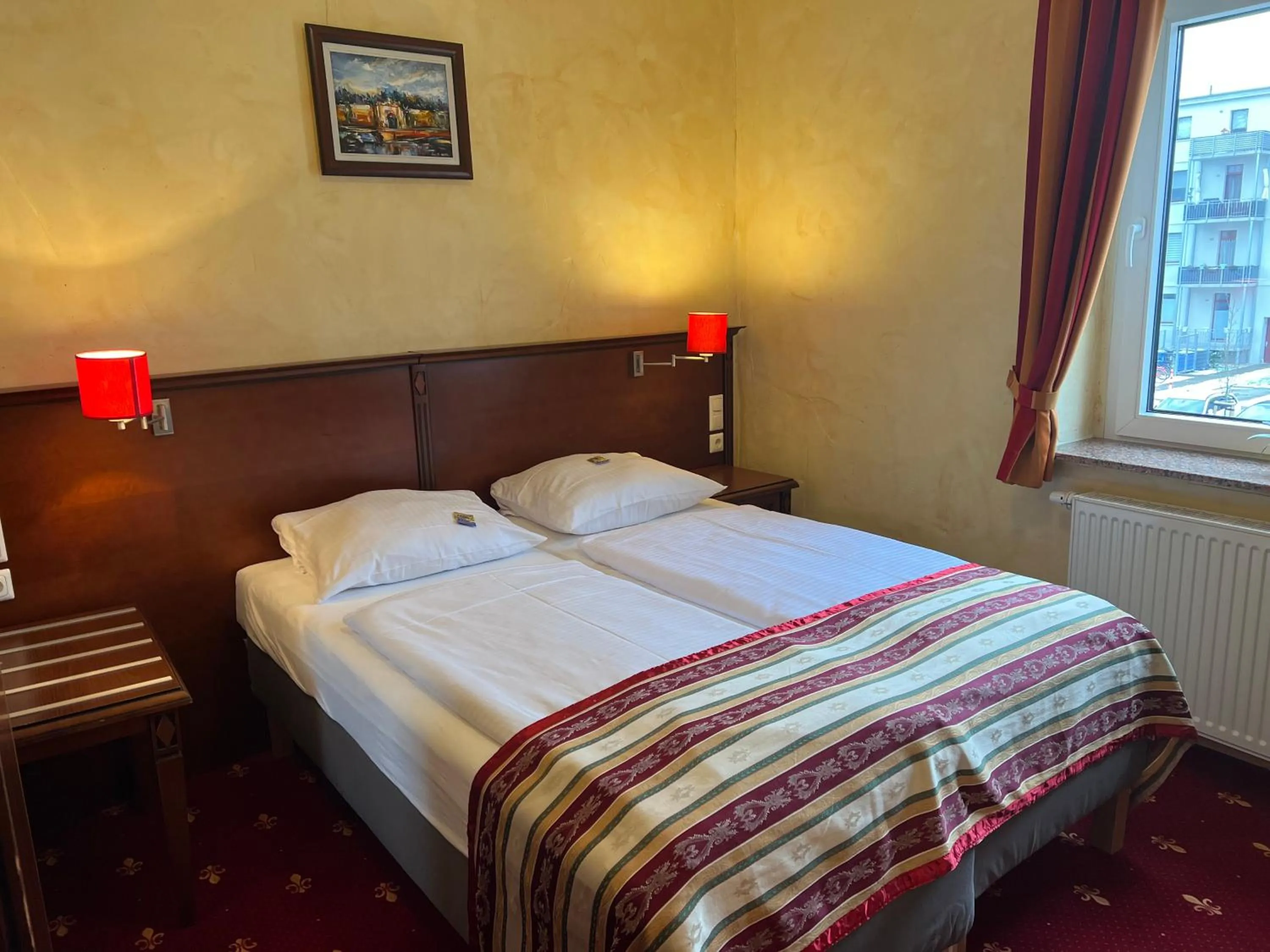 Bed in Hotel Medaillon