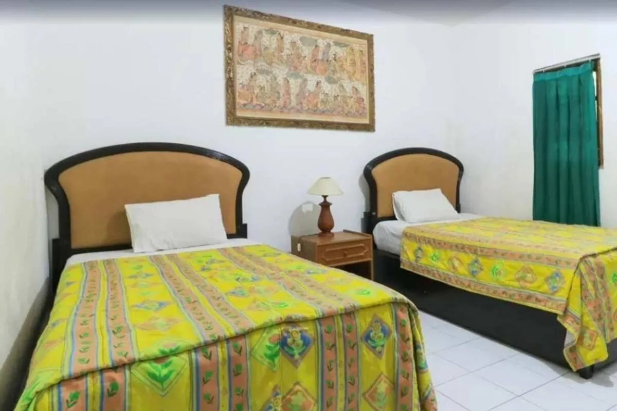 Bed in SANJAYA HOTEL