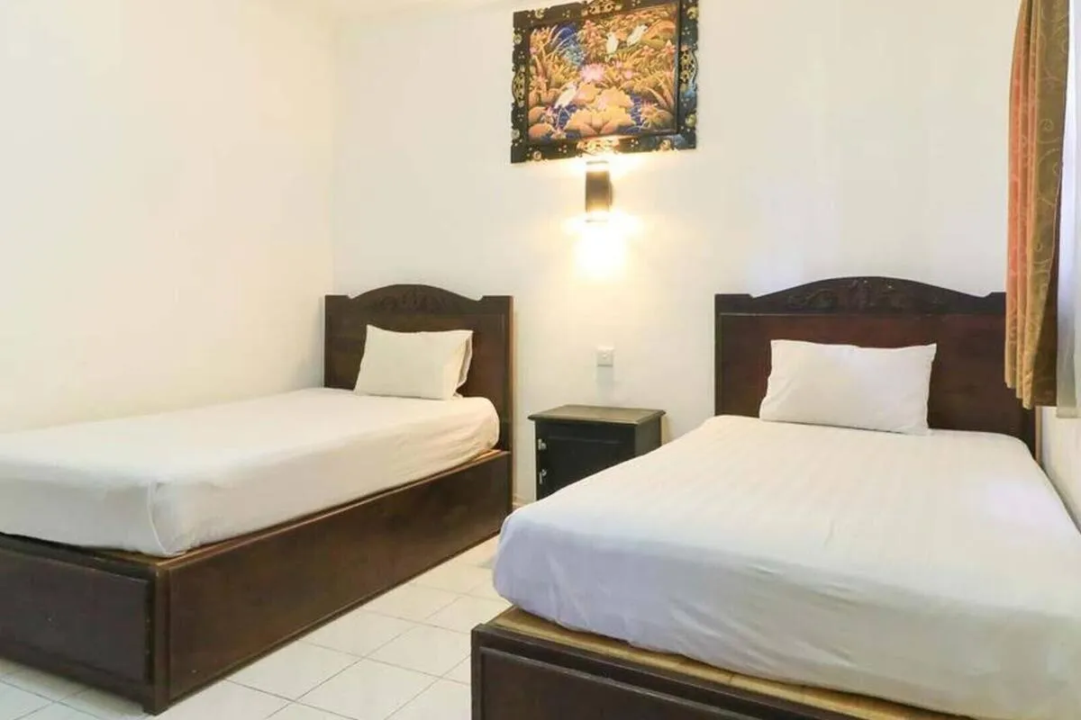 Bed in SANJAYA HOTEL