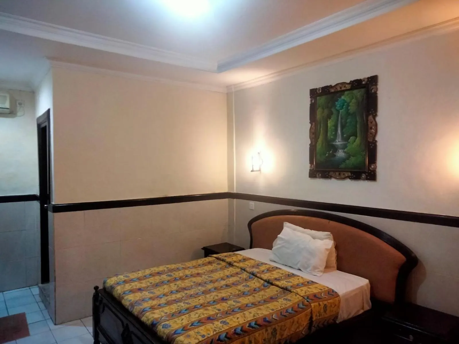 Bed in SANJAYA HOTEL