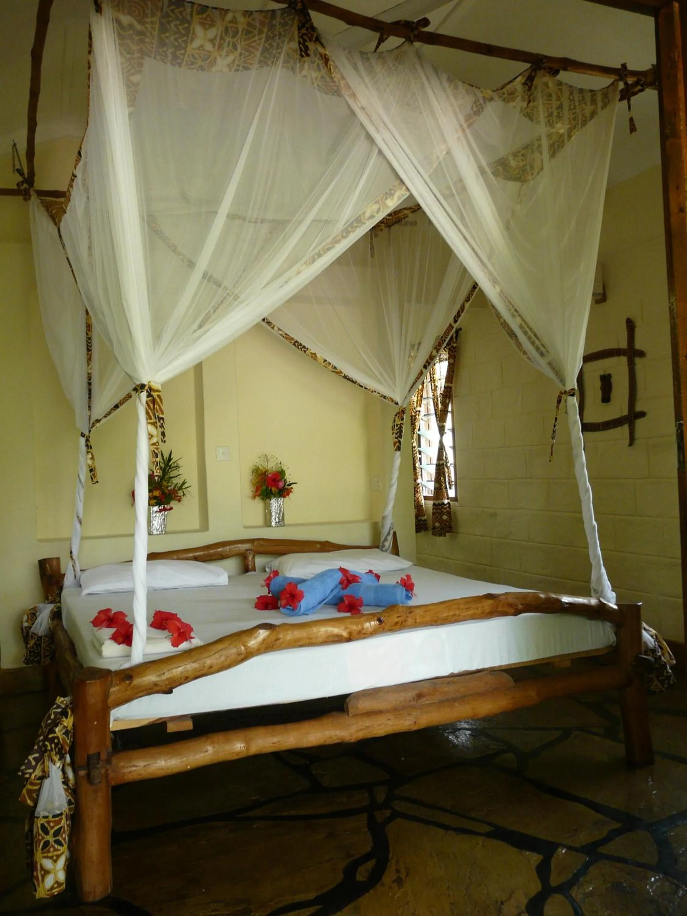 Photo of the whole room, Bed in African Dream Cottages - Diani Beach