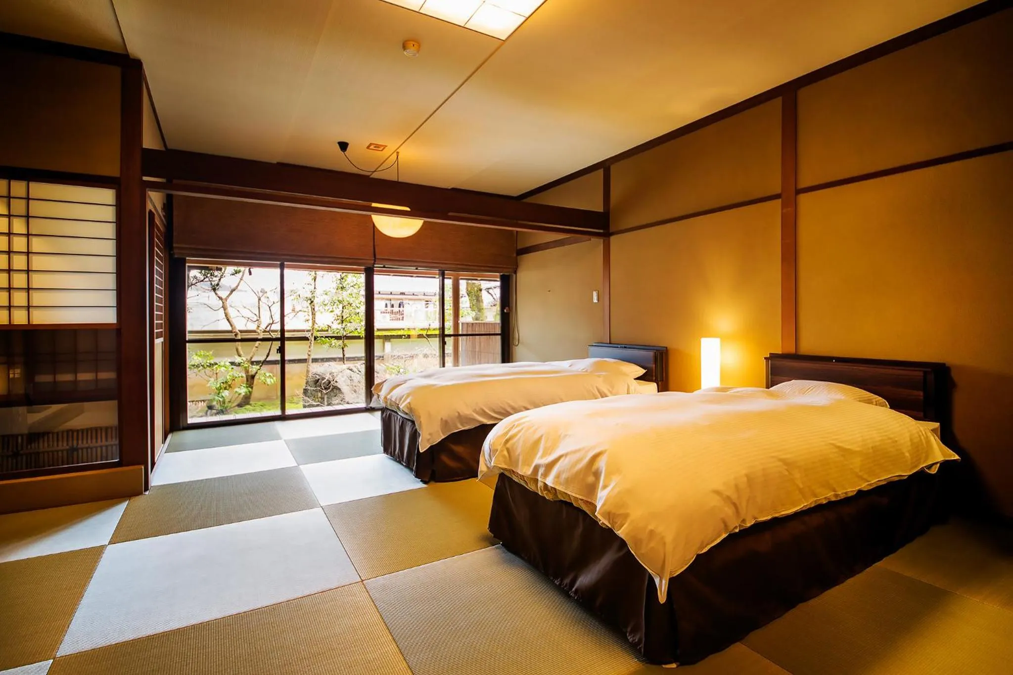 Bed in Ryoutei Ryokan Yasui