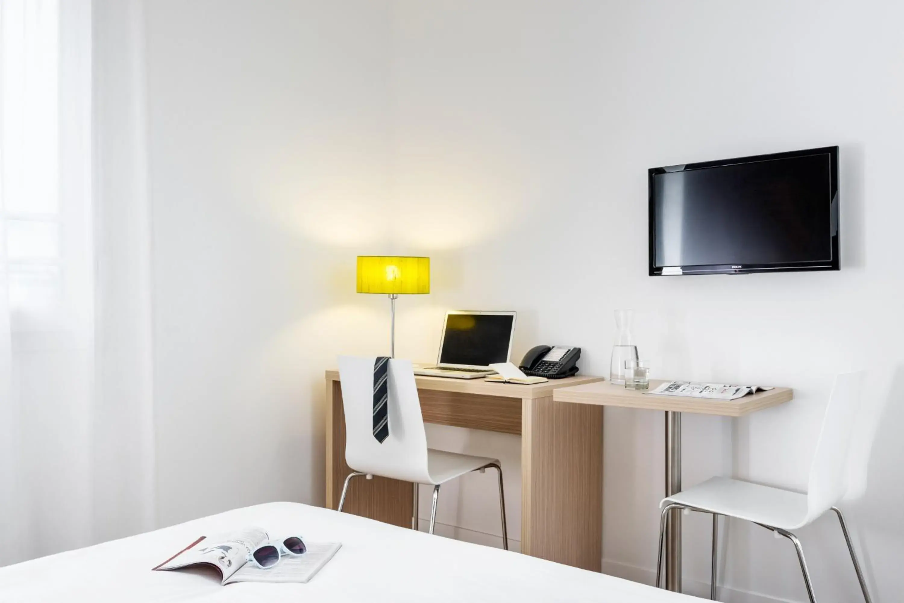 Seating area, Bed in Aparthotel Adagio Access Dijon République Seating area, Bed in Aparthotel Adagio Access Dijon République