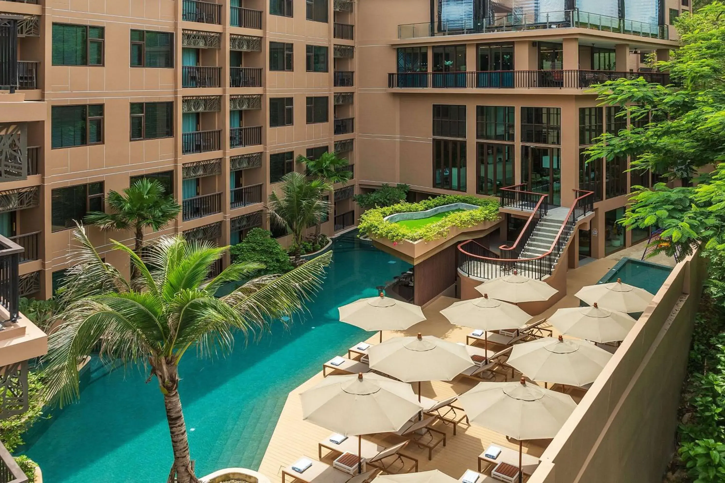 Pool view in The Proud Karon Beach Phuket Trademark Collection By Wyndham Pool view in The Proud Karon Beach Phuket Trademark Collection By Wyndham