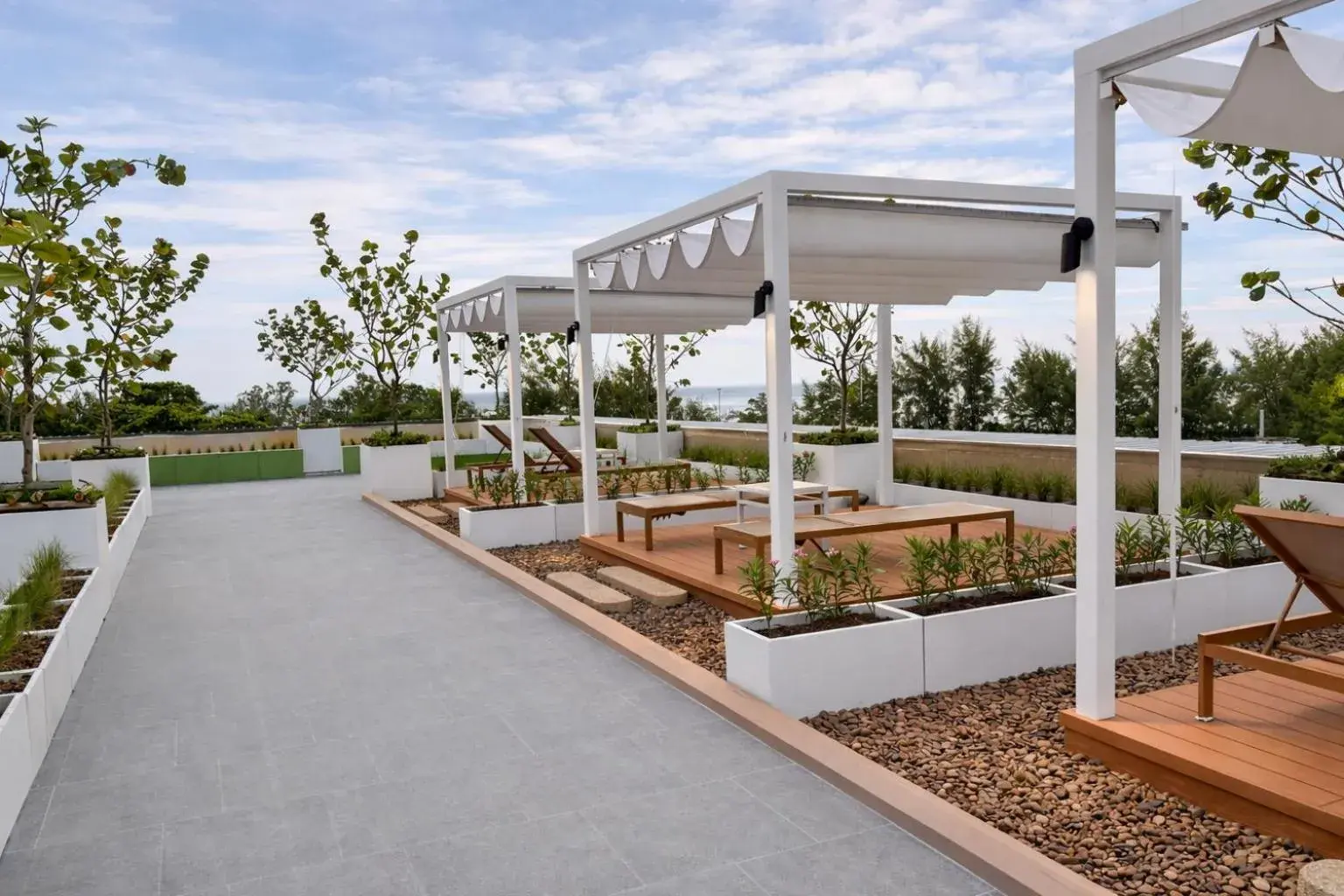 Swimming pool in The Proud Karon Beach Phuket Trademark Collection By Wyndham Swimming pool in The Proud Karon Beach Phuket Trademark Collection By Wyndham