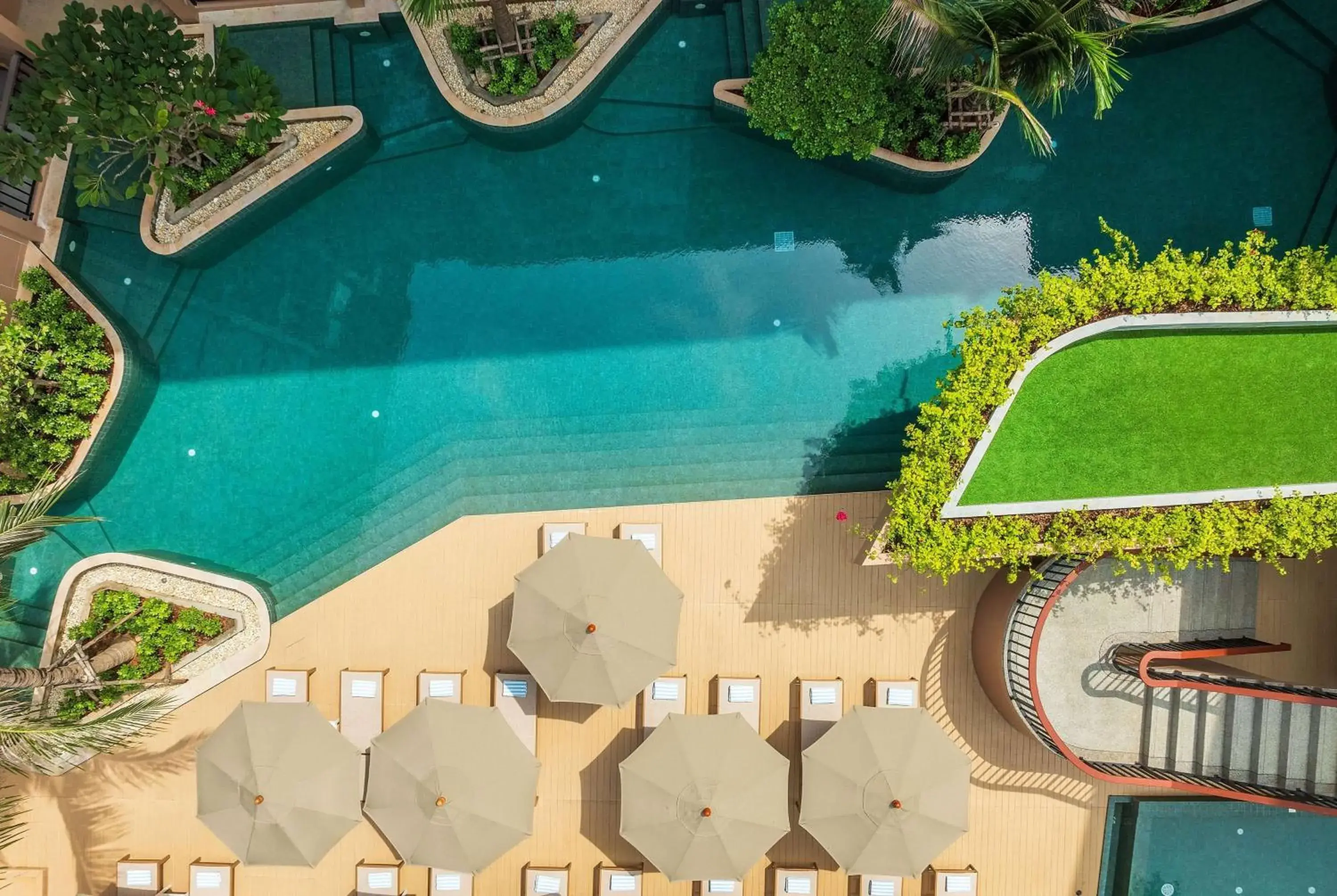 Pool view in The Proud Karon Beach Phuket Trademark Collection By Wyndham Pool view in The Proud Karon Beach Phuket Trademark Collection By Wyndham