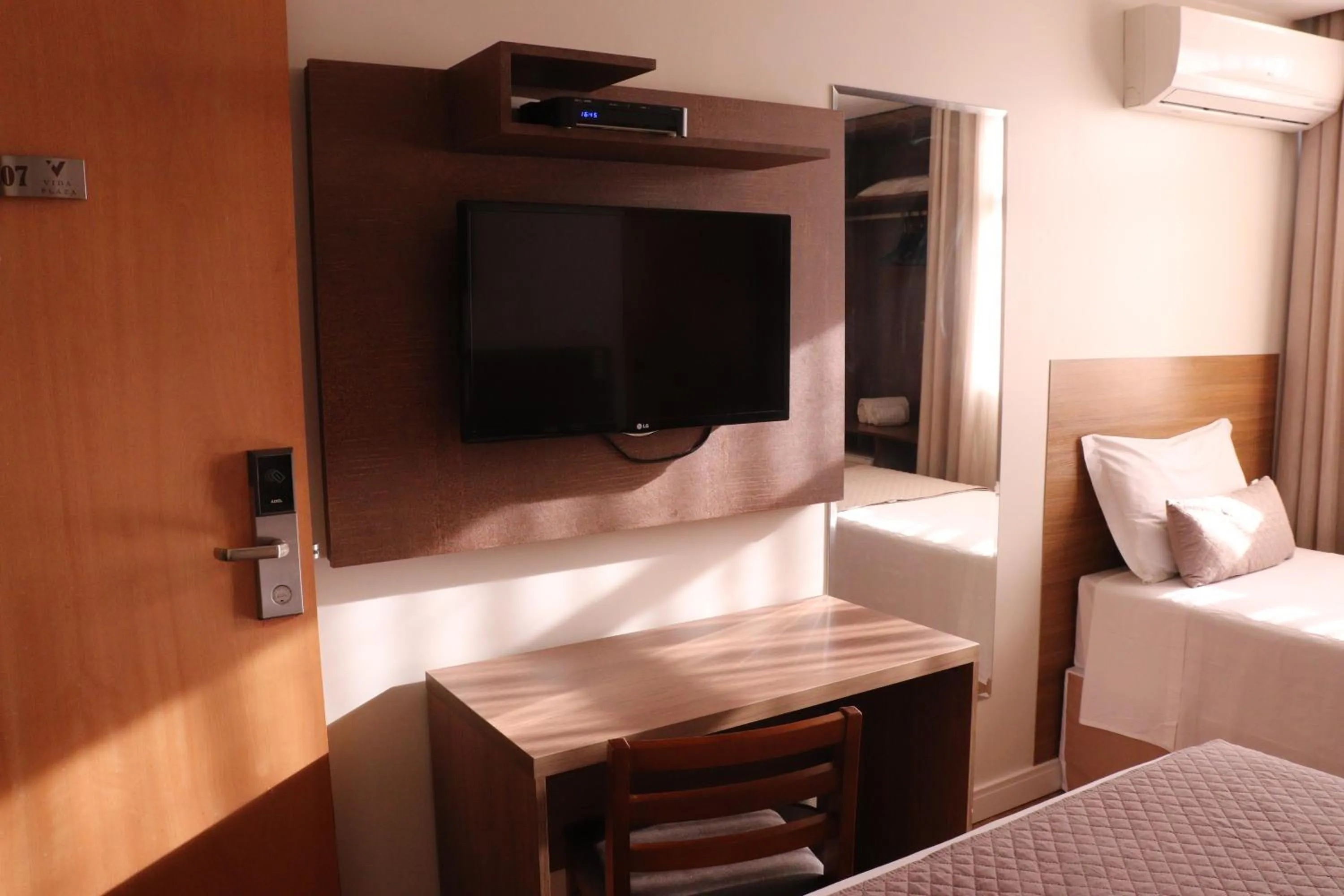 Bed in Vida Plaza Hotel