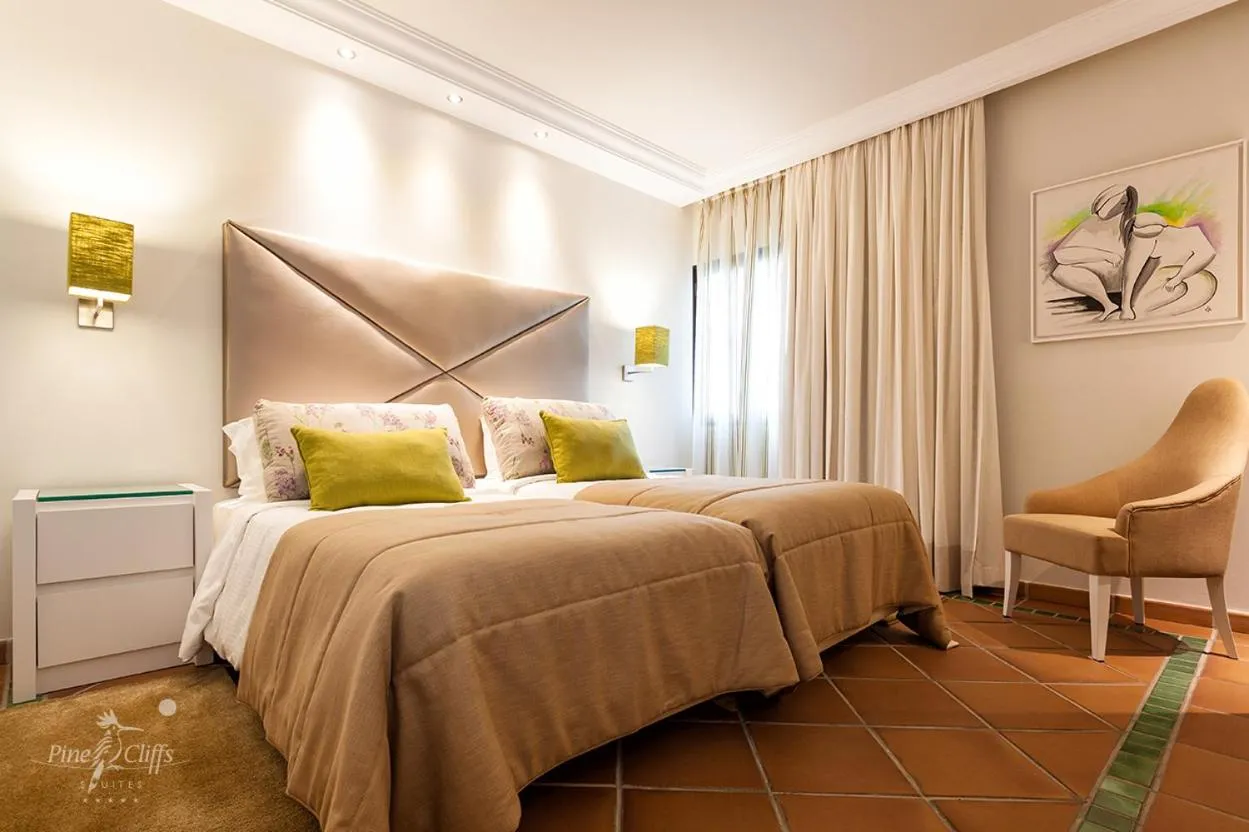 Bed in Pine Cliffs Suites