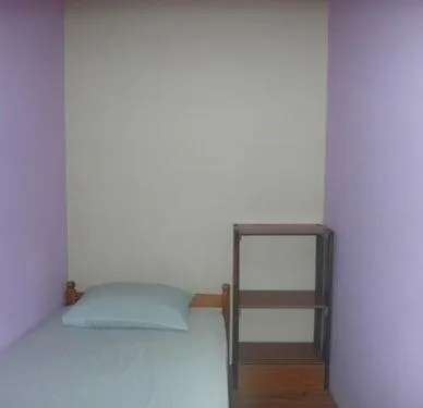 Bed in Oasis Guest House