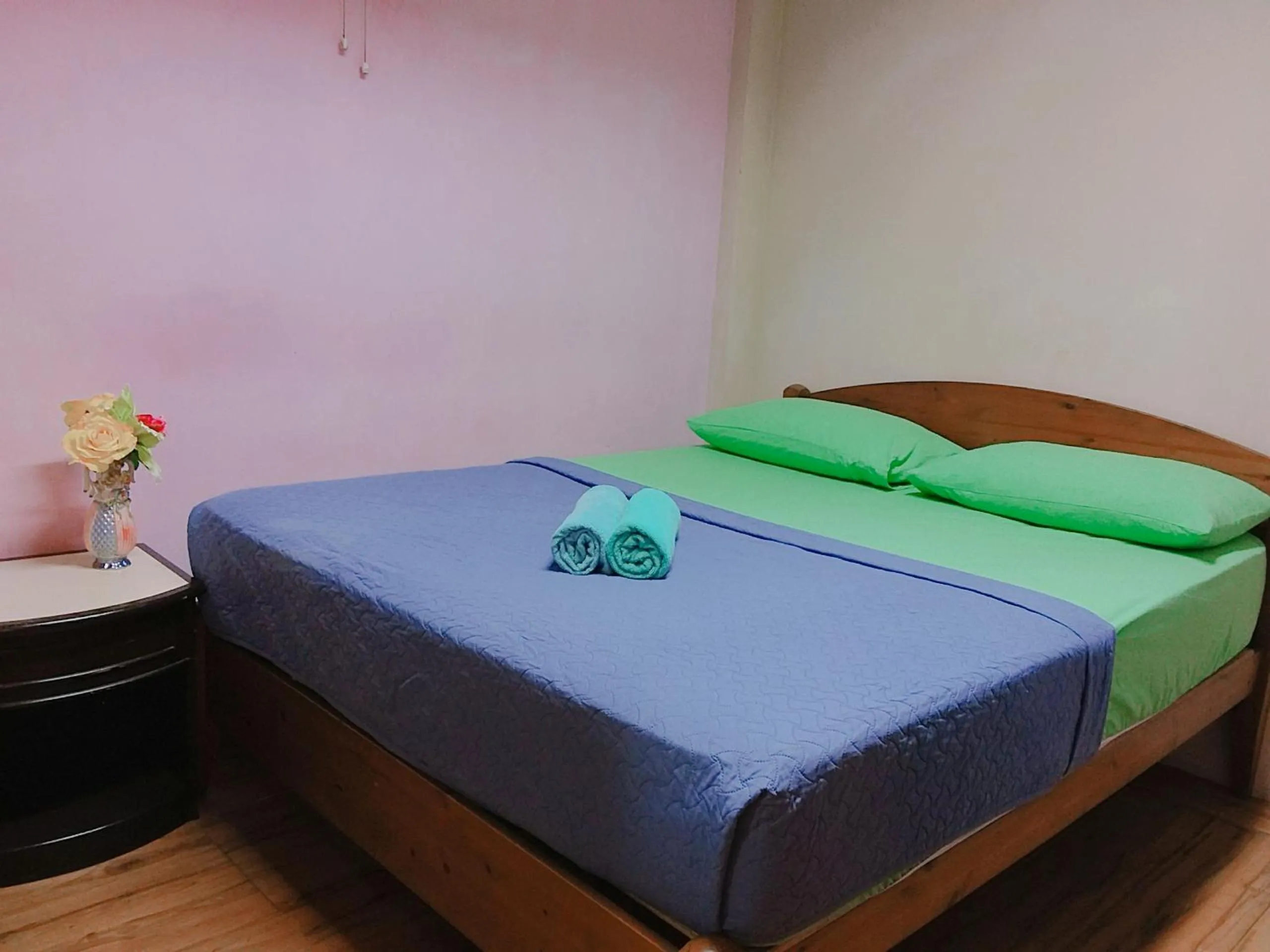 Bed in Oasis Guest House