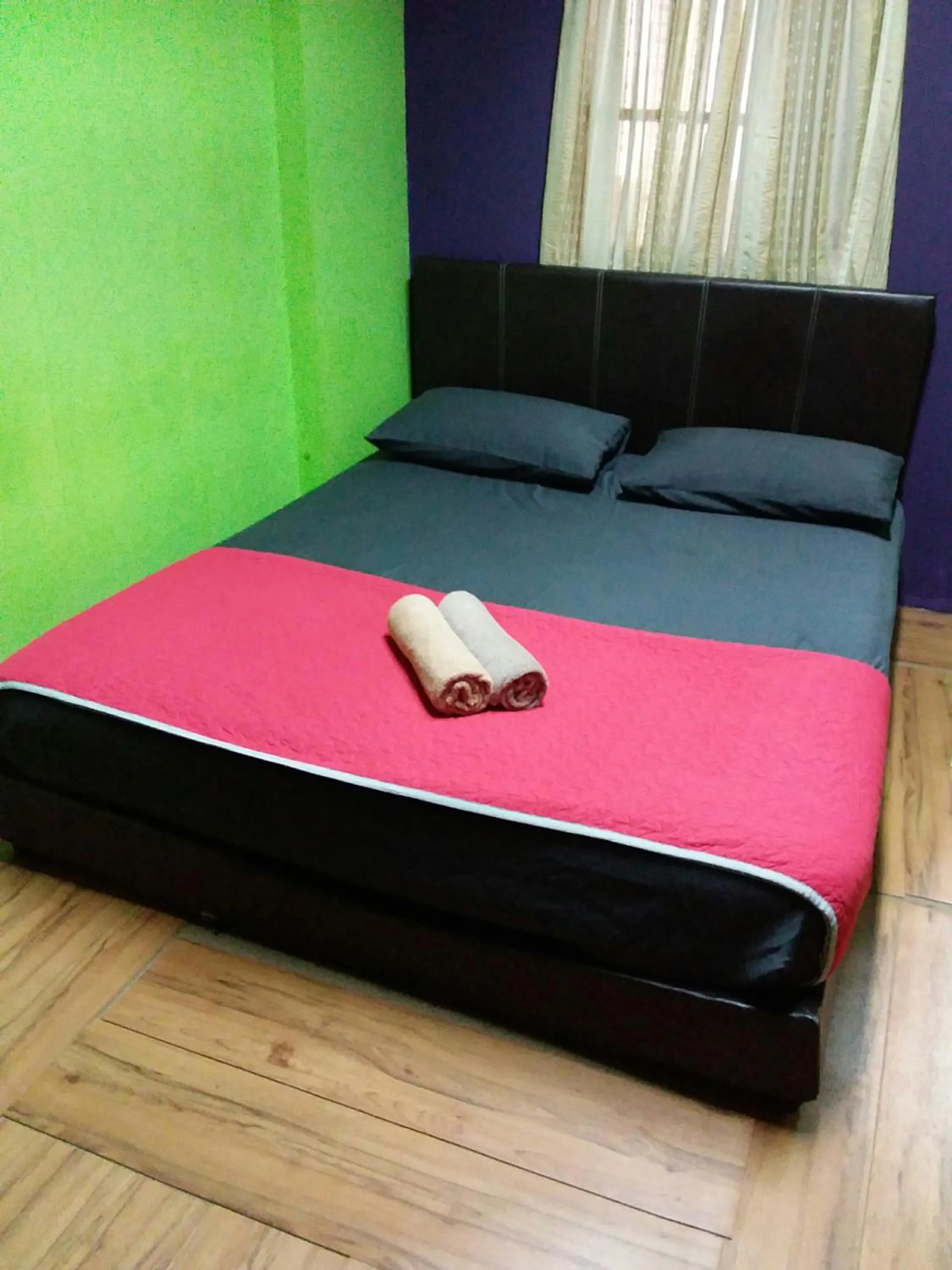 Bed in Oasis Guest House