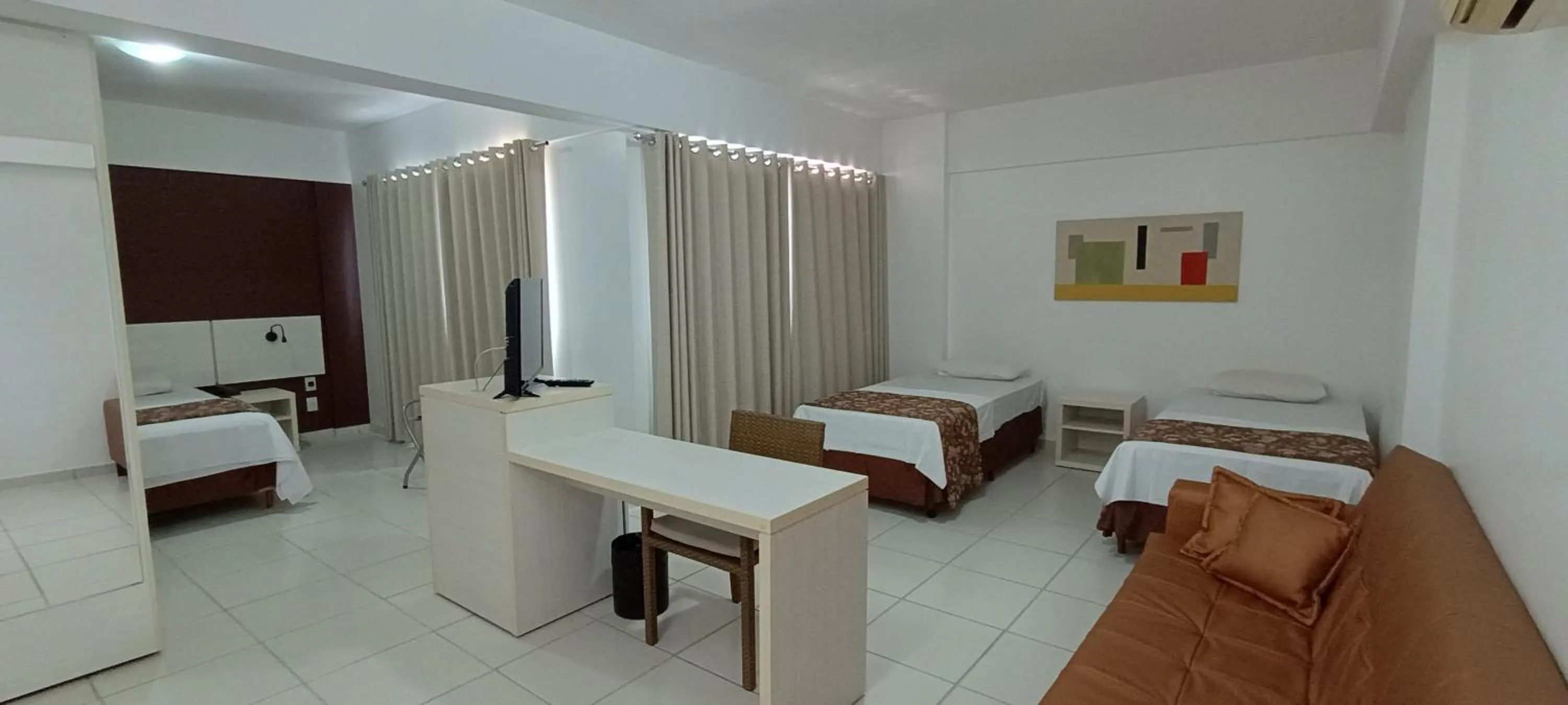 Bed in Le Jardin Suíte Studio