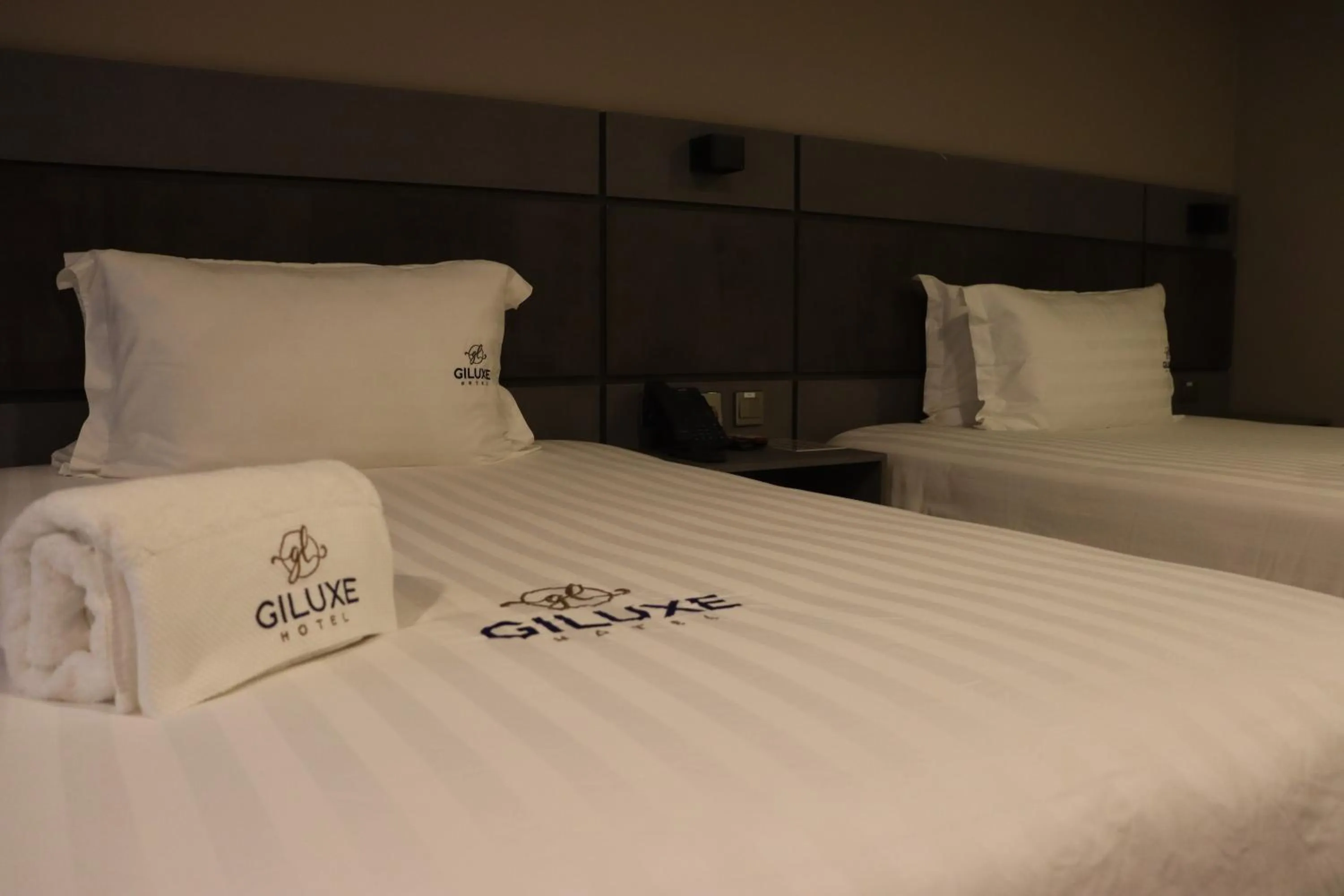Bed in Giluxe Hotel