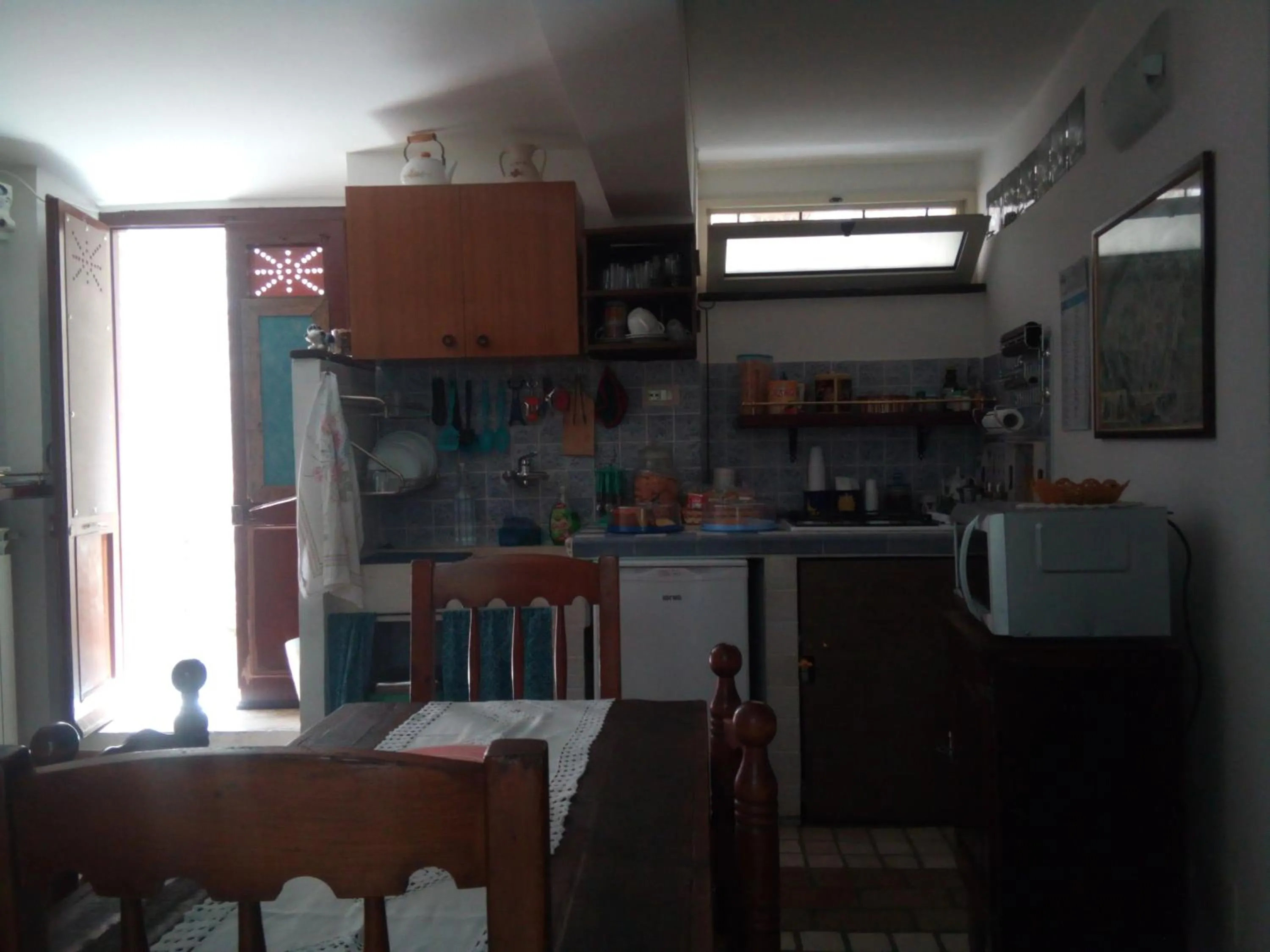 Communal kitchen in Calì B&B