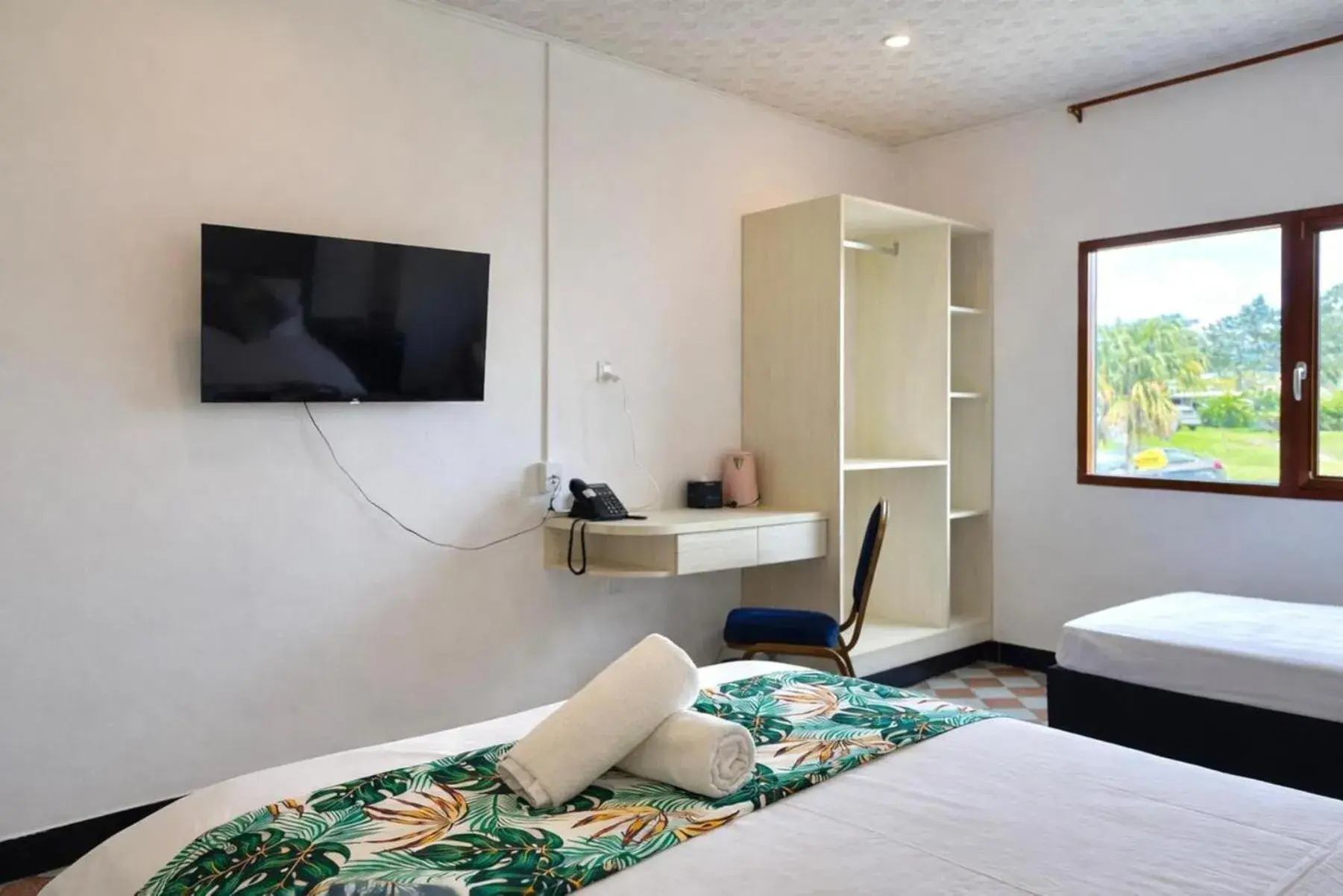 Communal lounge/ TV room, Bed in Crown Royale Hotel & Lounge Communal lounge/ TV room, Bed in Crown Royale Hotel & Lounge