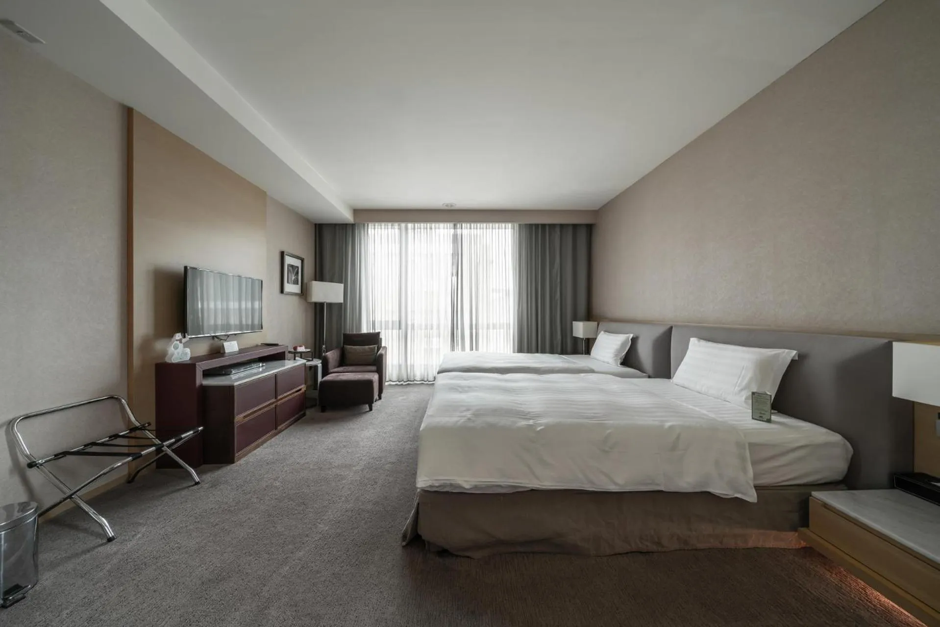 Bed in Taipung Suites