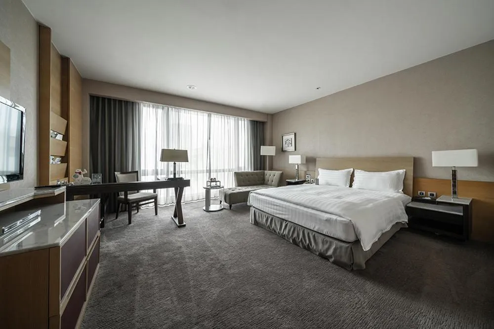 Bed in Taipung Suites