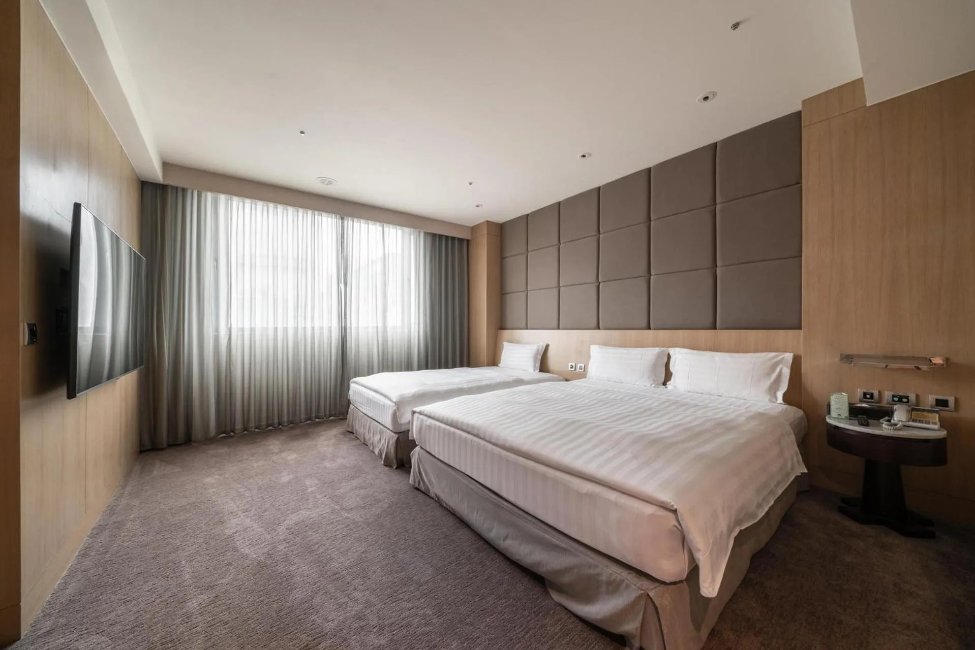 Bed in Taipung Suites