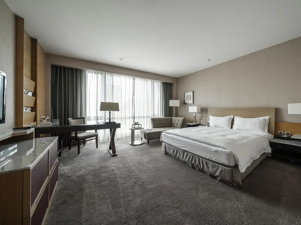 Bed in Taipung Suites