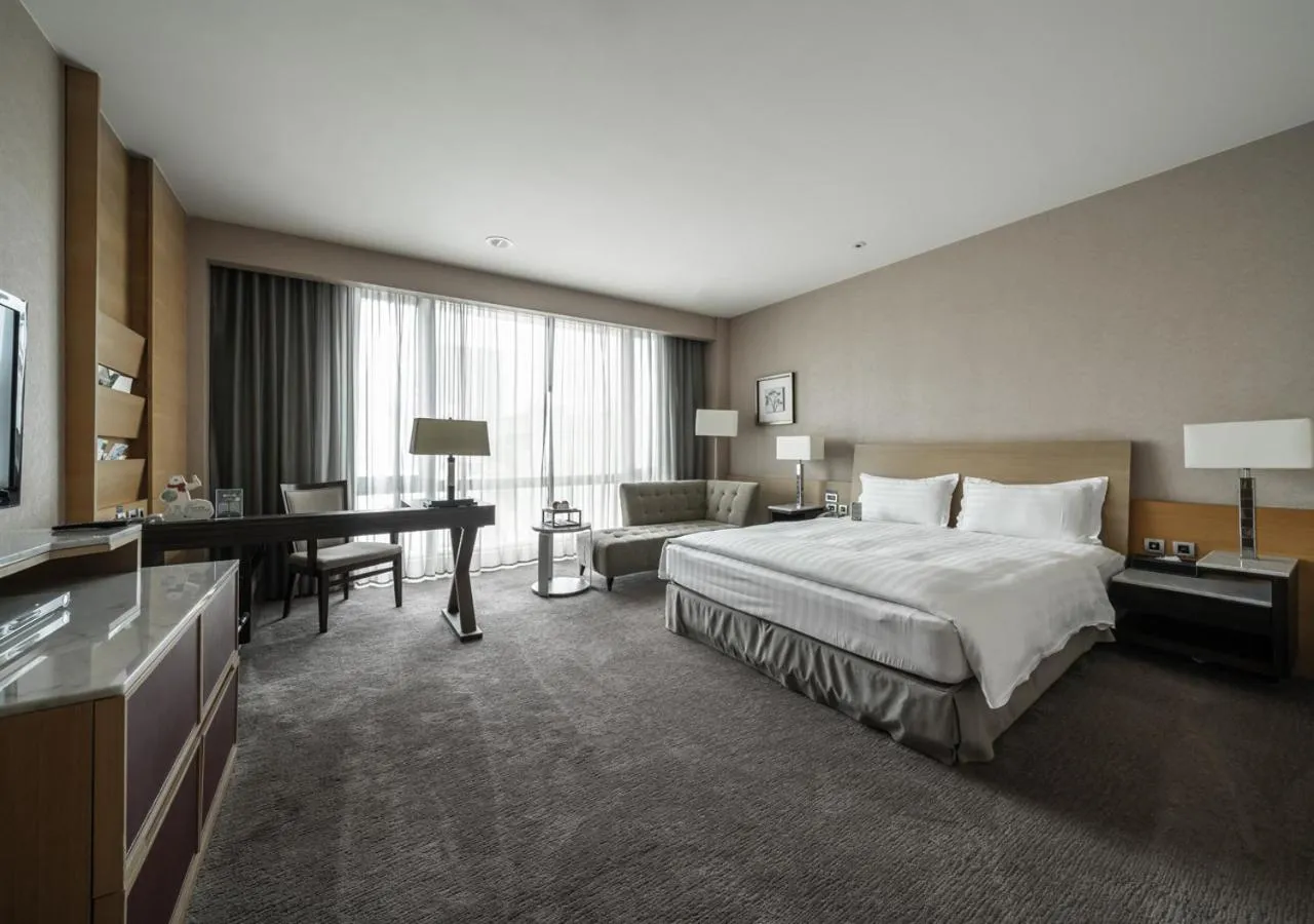 Bed in Taipung Suites