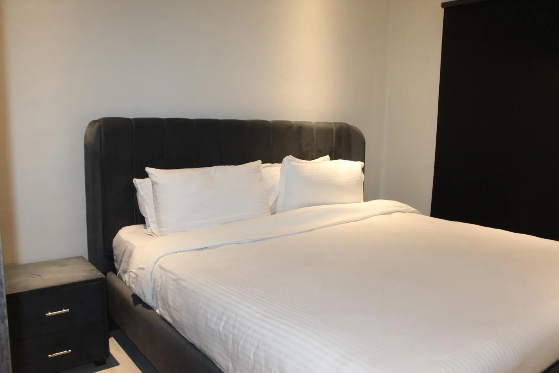 Bed in The Opus Luxury Residences
