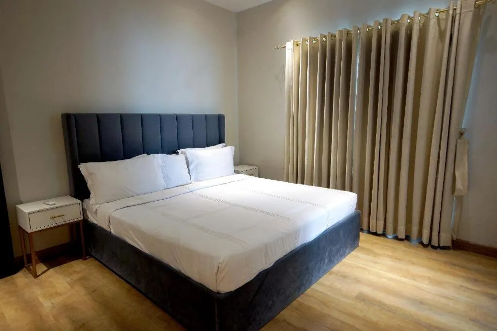 Bed in The Opus Luxury Residences