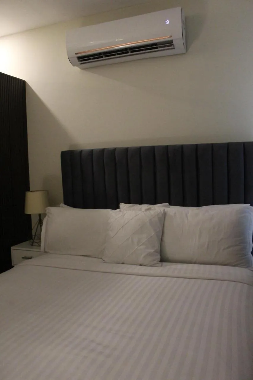 Bed in The Opus Luxury Residences