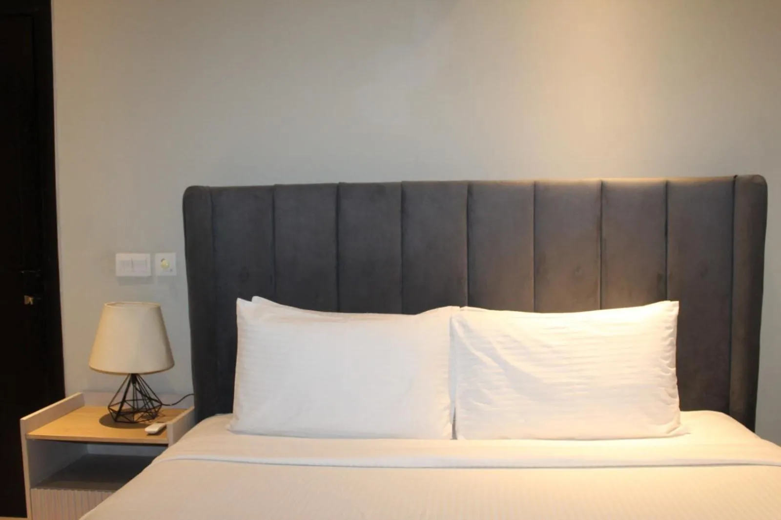 Bed in The Opus Luxury Residences